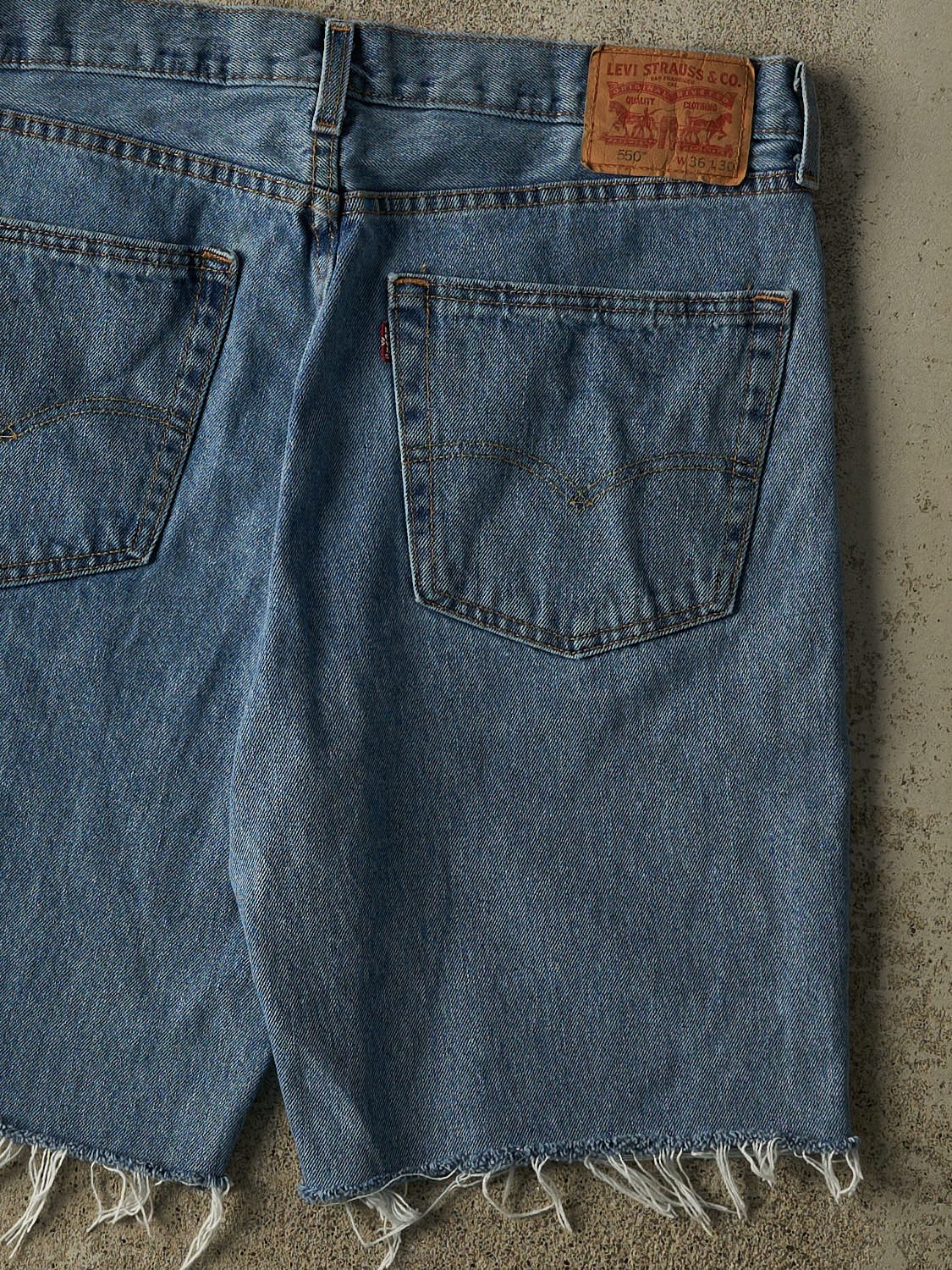 Vintage 90s Mid Wash Levi's 550 Cut Off Jean Shorts (36x10)