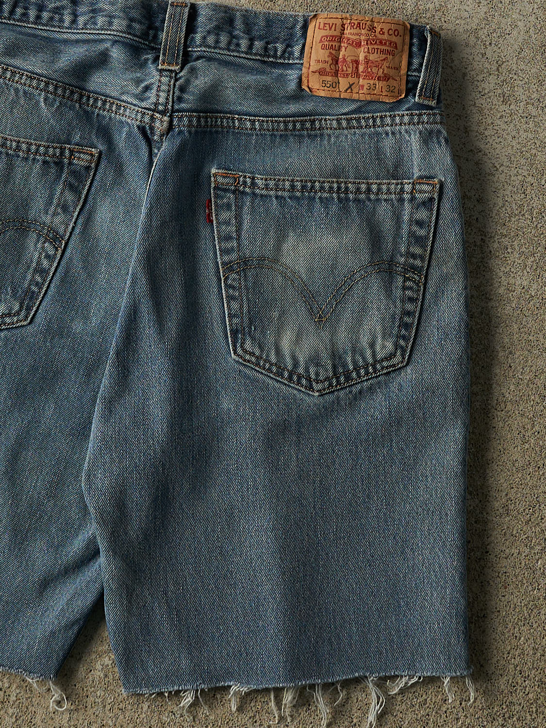 Vintage 90s Mid Wash Levi's 550 Cut Off Jean Shorts (32x9)