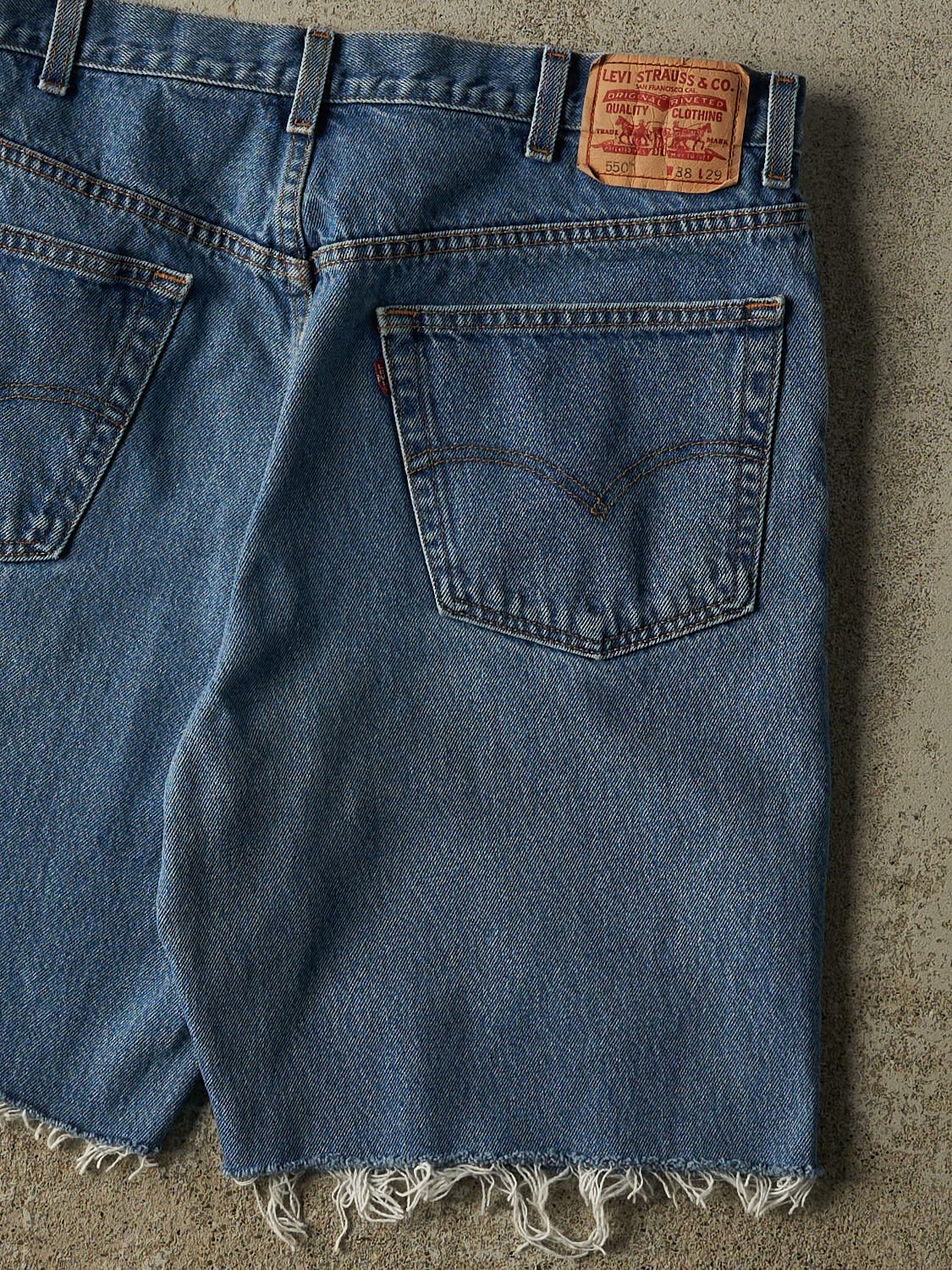 Vintage 90s Mid Wash Levi's 550 Cut Off Jean Shorts (36x9.5)
