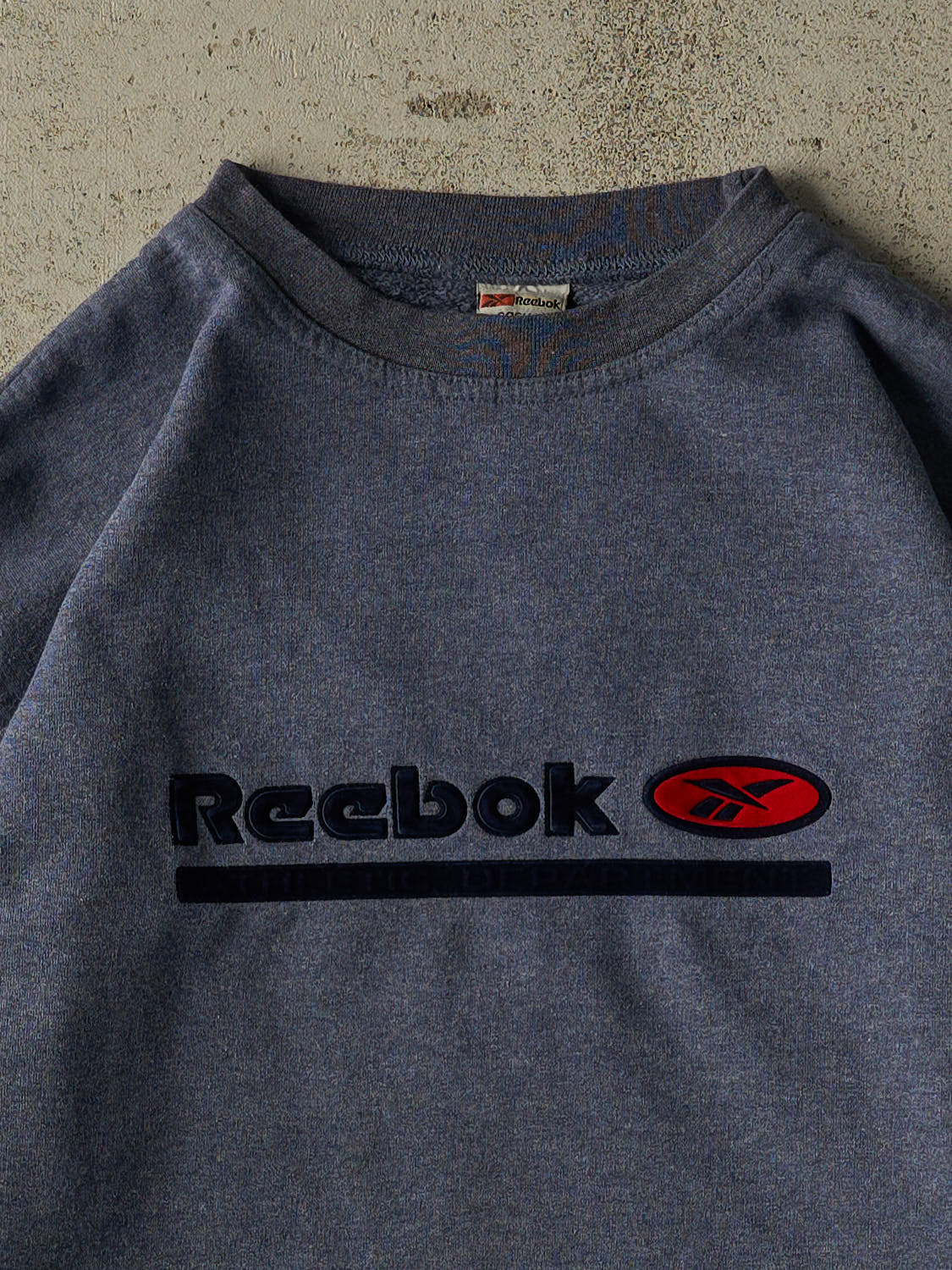 Vintage 90s Washed Blue Reebok Crewneck (L/XL)