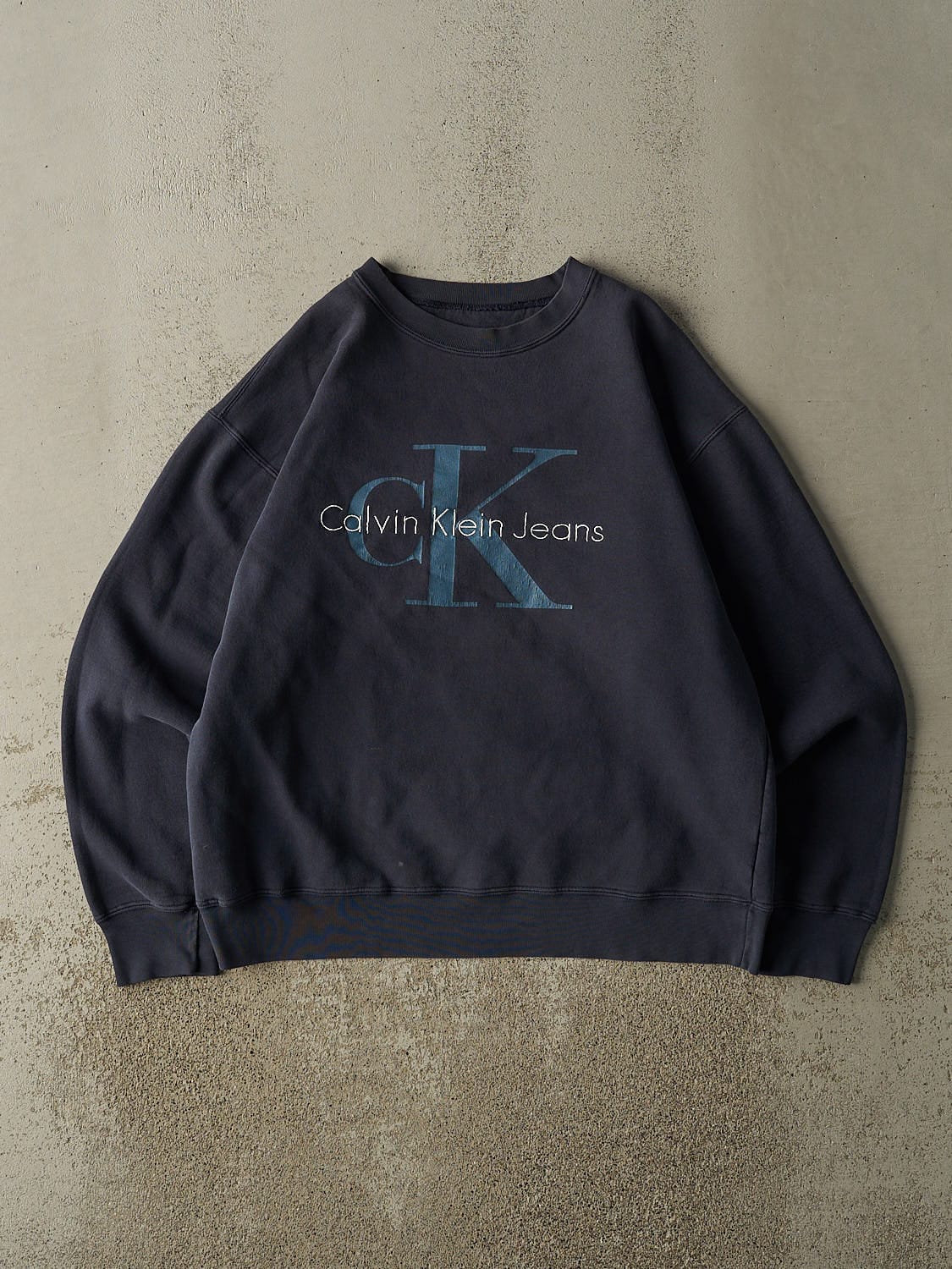 Vintage 90s Sun Faded Navy Calvin Klein Jean Embroidered Crewneck (M/L)