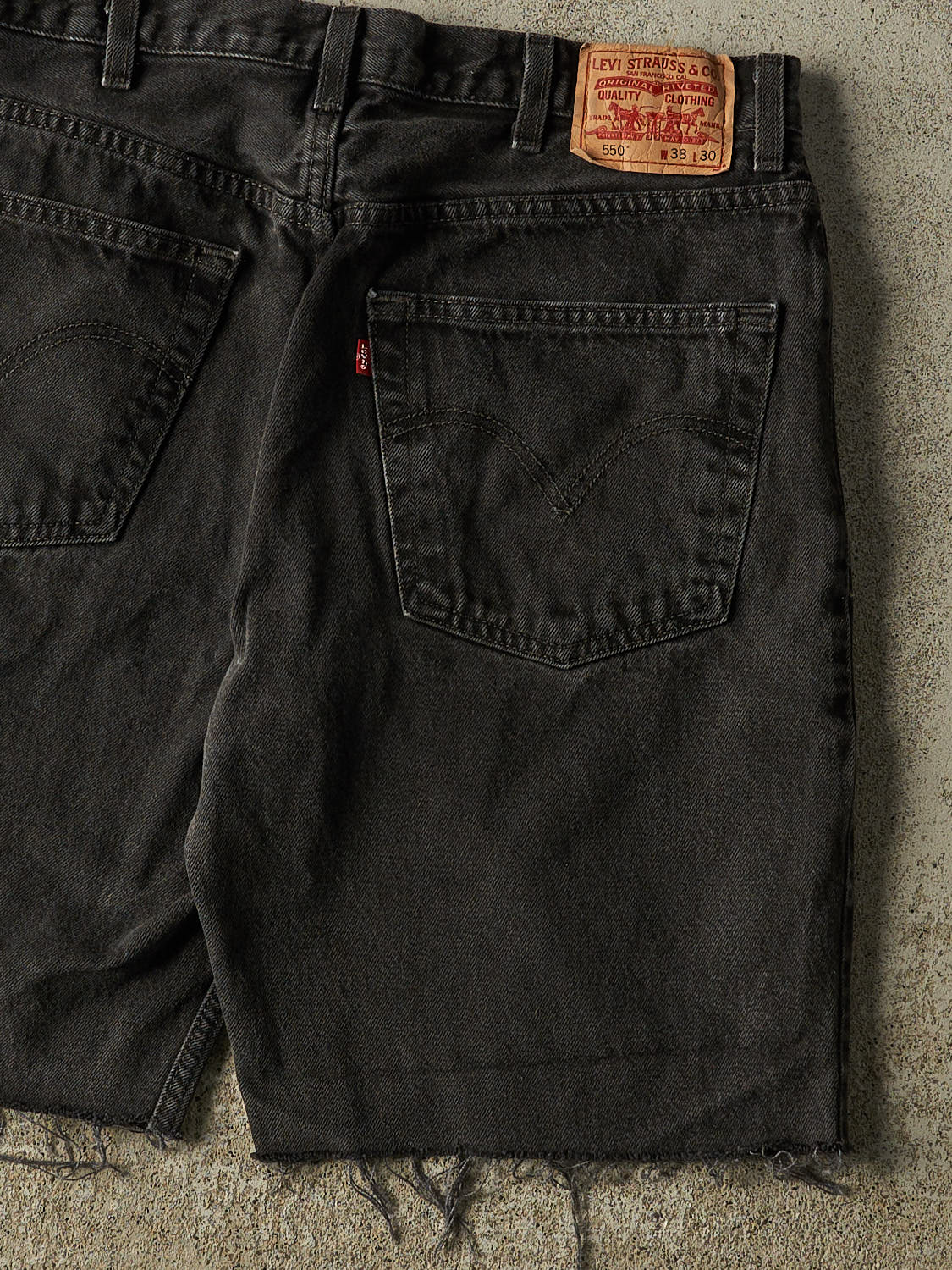 Vintage 90s Black Levi's 550 Cut Off Denim Shorts (35x9.5)