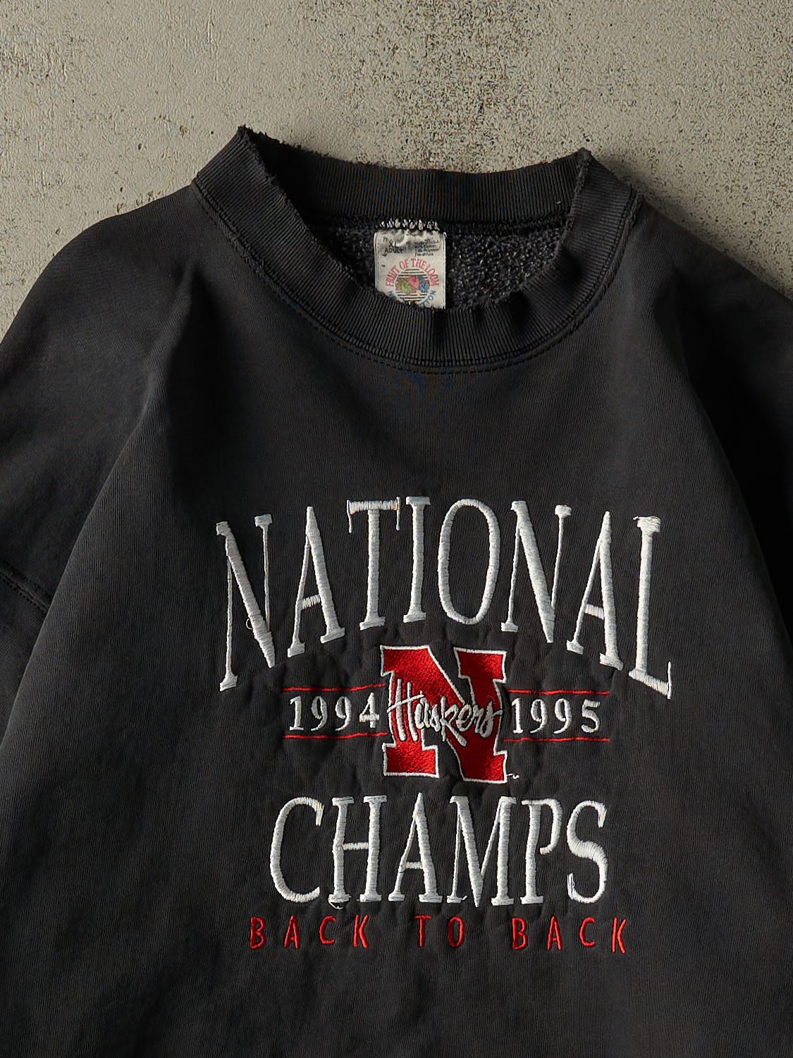 Vintage 95' Faded Black Nebraska University Embroidered Crewneck (L)