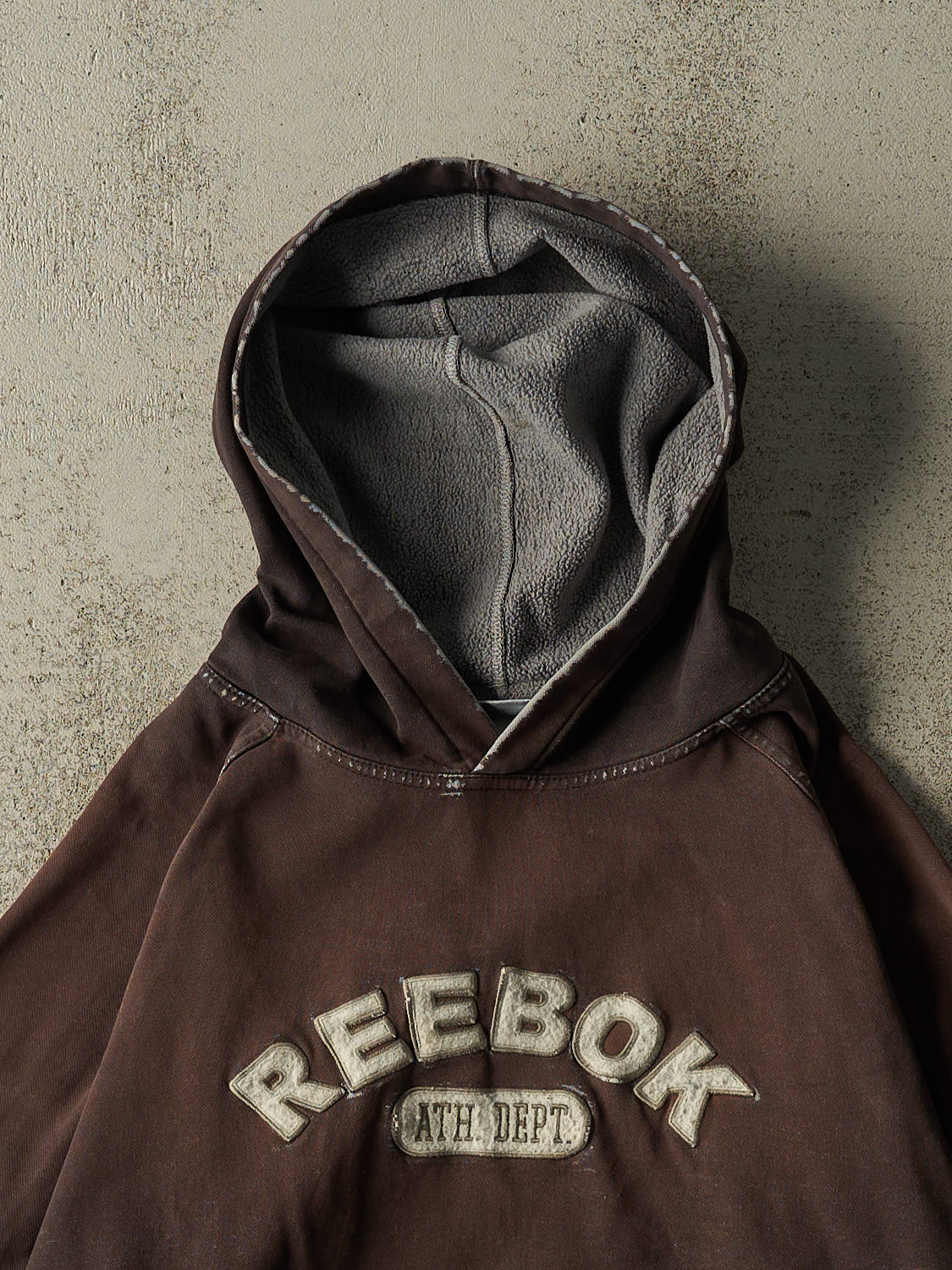 Vintage 90s Sun Faded Black Reebok Embroidered Hoodie (L/XL)