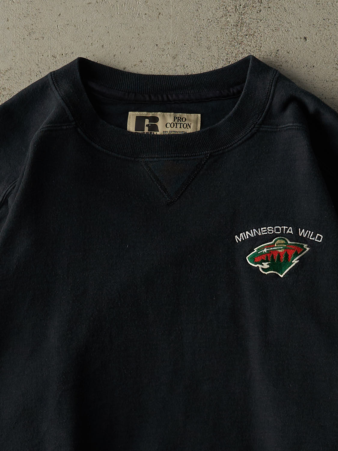 Vintage 90s Faded Black Minnesota Wild Embroidered Russell Athletic Crewneck (L)