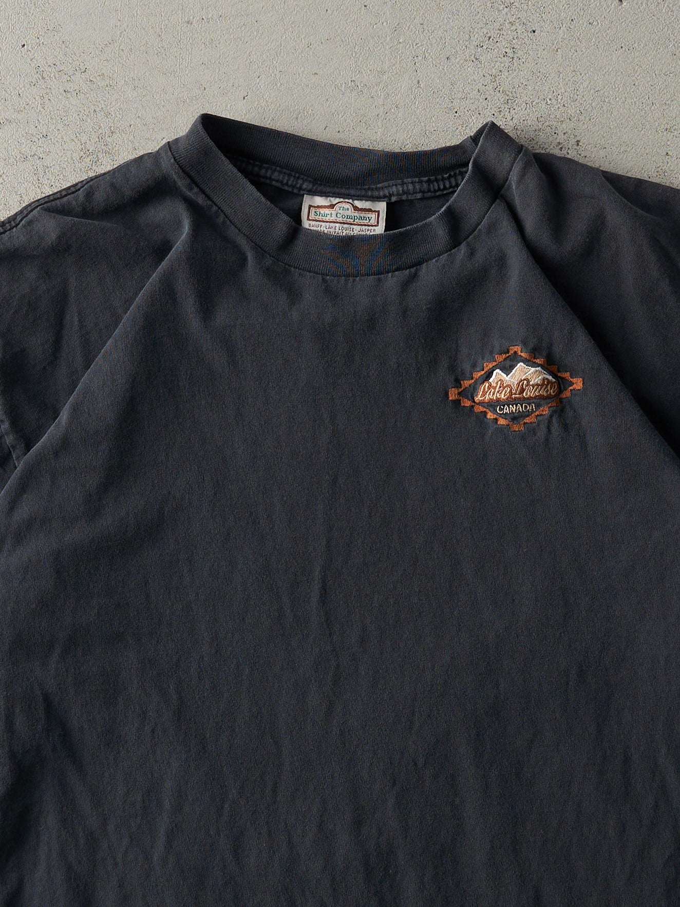 Vintage 90s Faded Black Embroidered Lake Louise Tee (L)