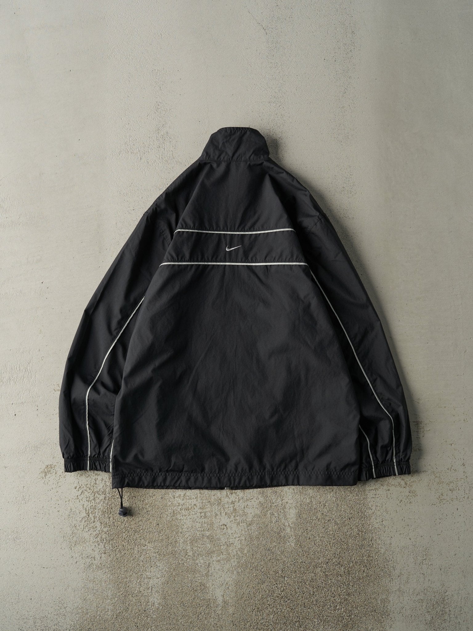 black and silver nike windbreaker
