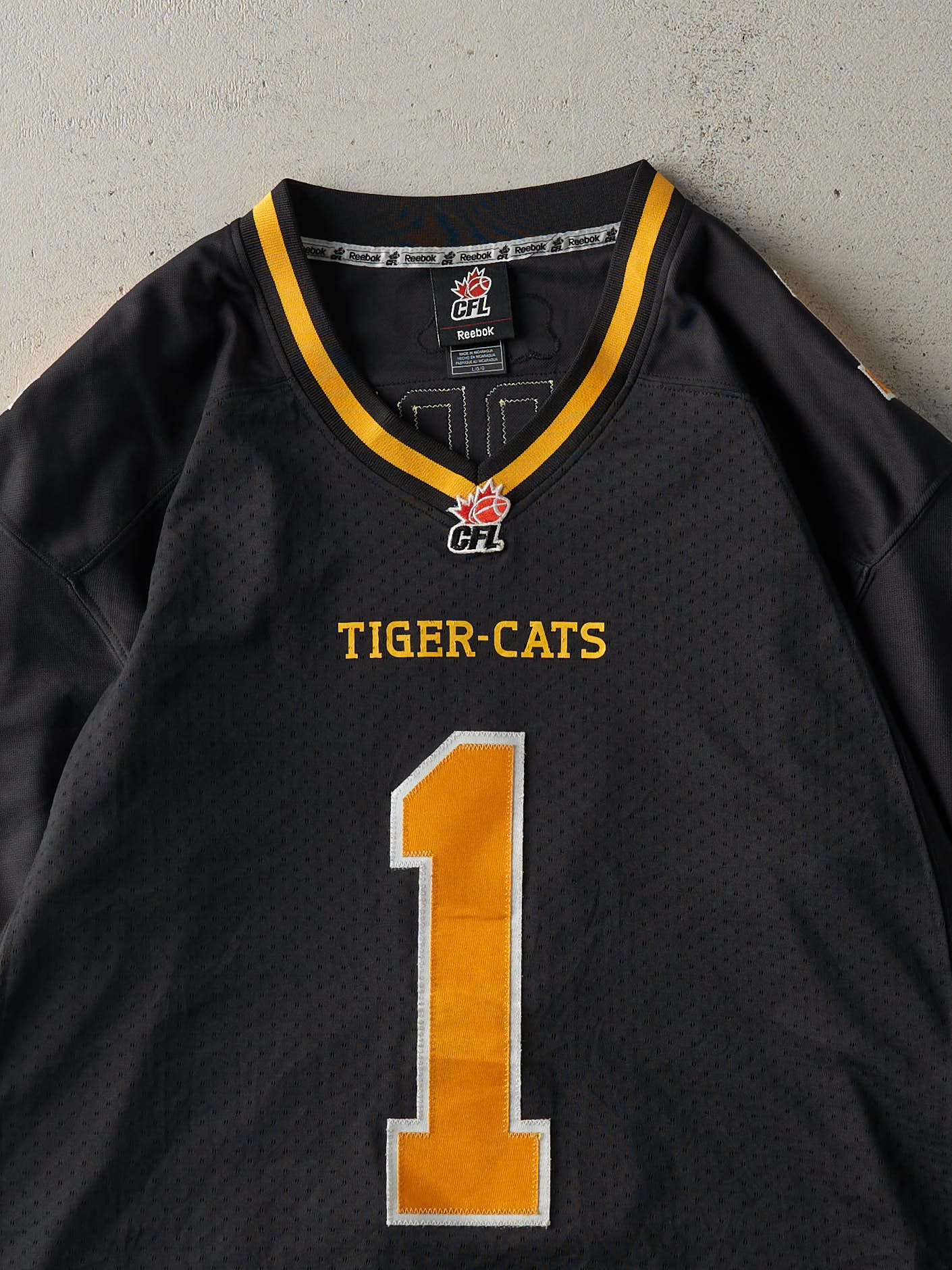 Vintage Y2K Black Hamilton Tiger-Cats #1 Henry Burris Cropped Football Jersey (L)