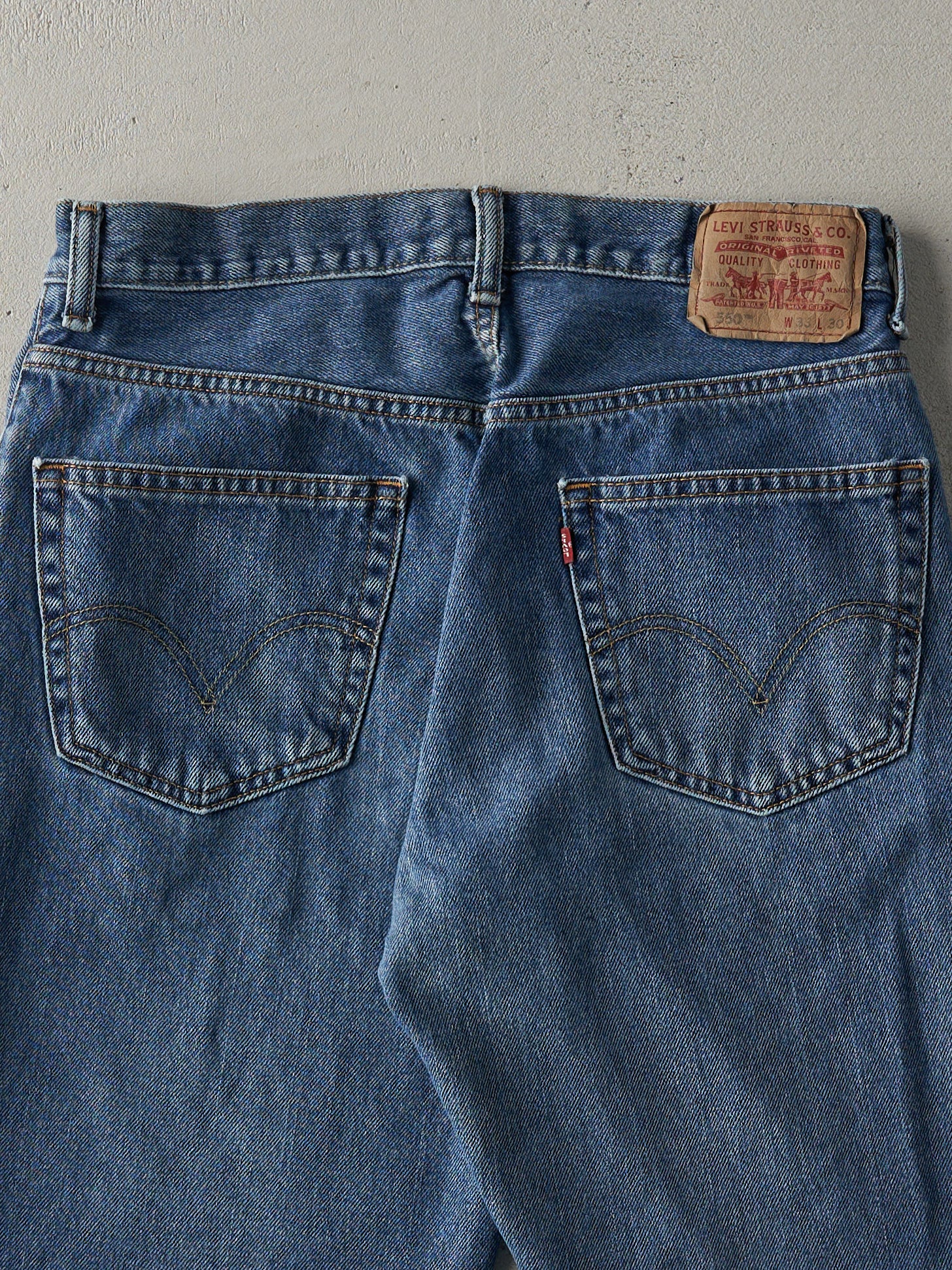 Vintage 90s Dark Wash Levi's 550 Relaxed Fit Cut Off Jean Shorts (32x9)