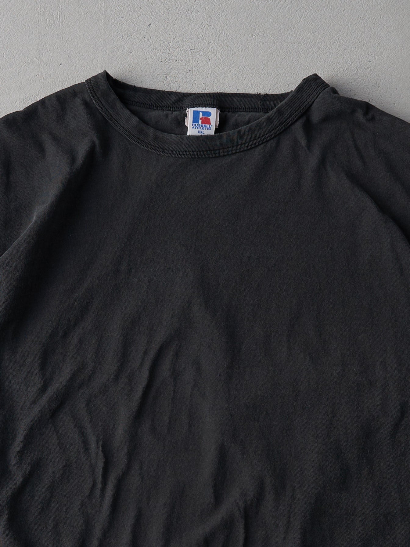 Vintage 90s Faded Black Russell Athletics Blank Tee (L/XL)