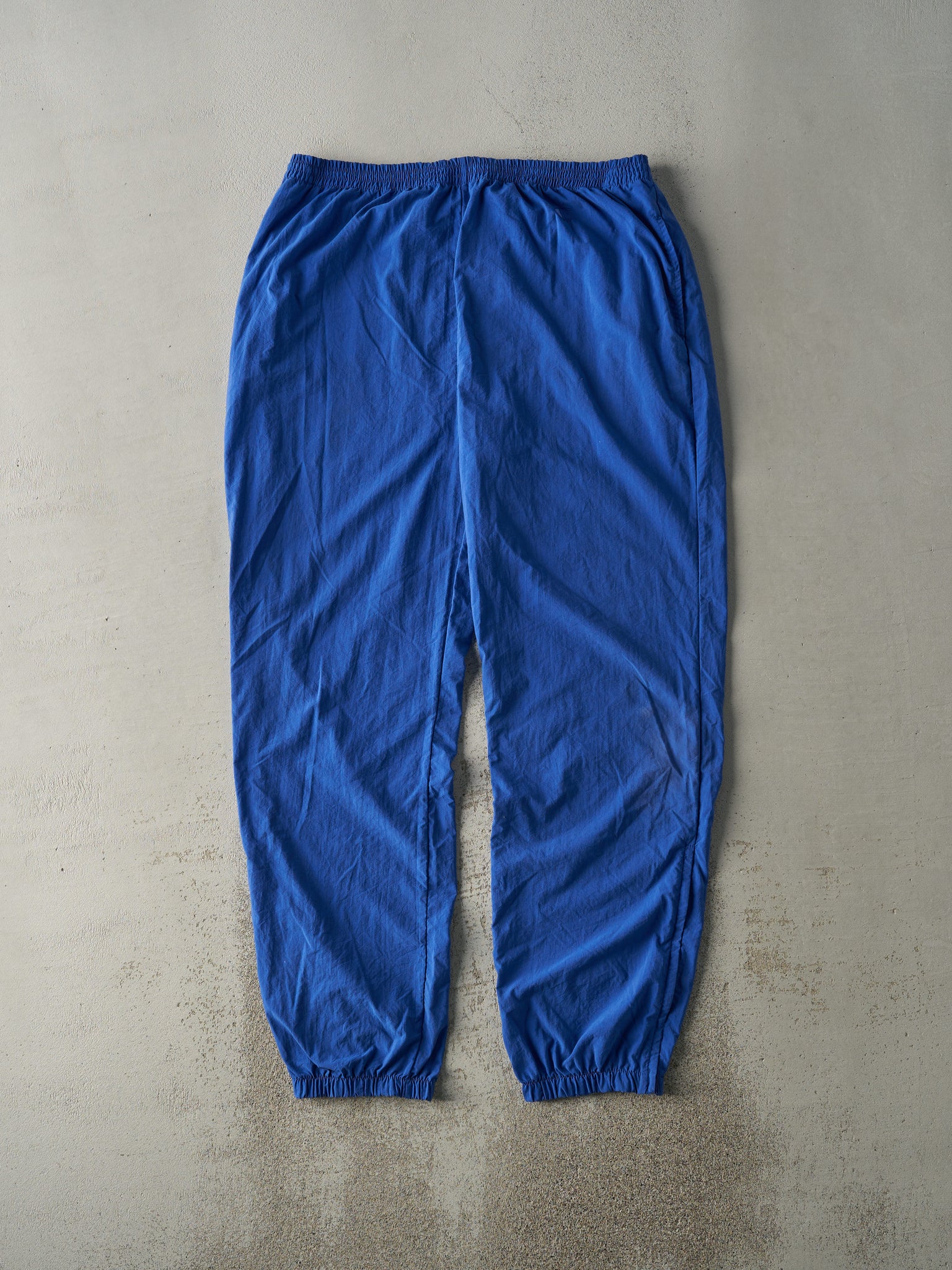 Vintage 90s Blue Champion Embroidered Logo Nylon Windbreaker Pants (36x32.5)