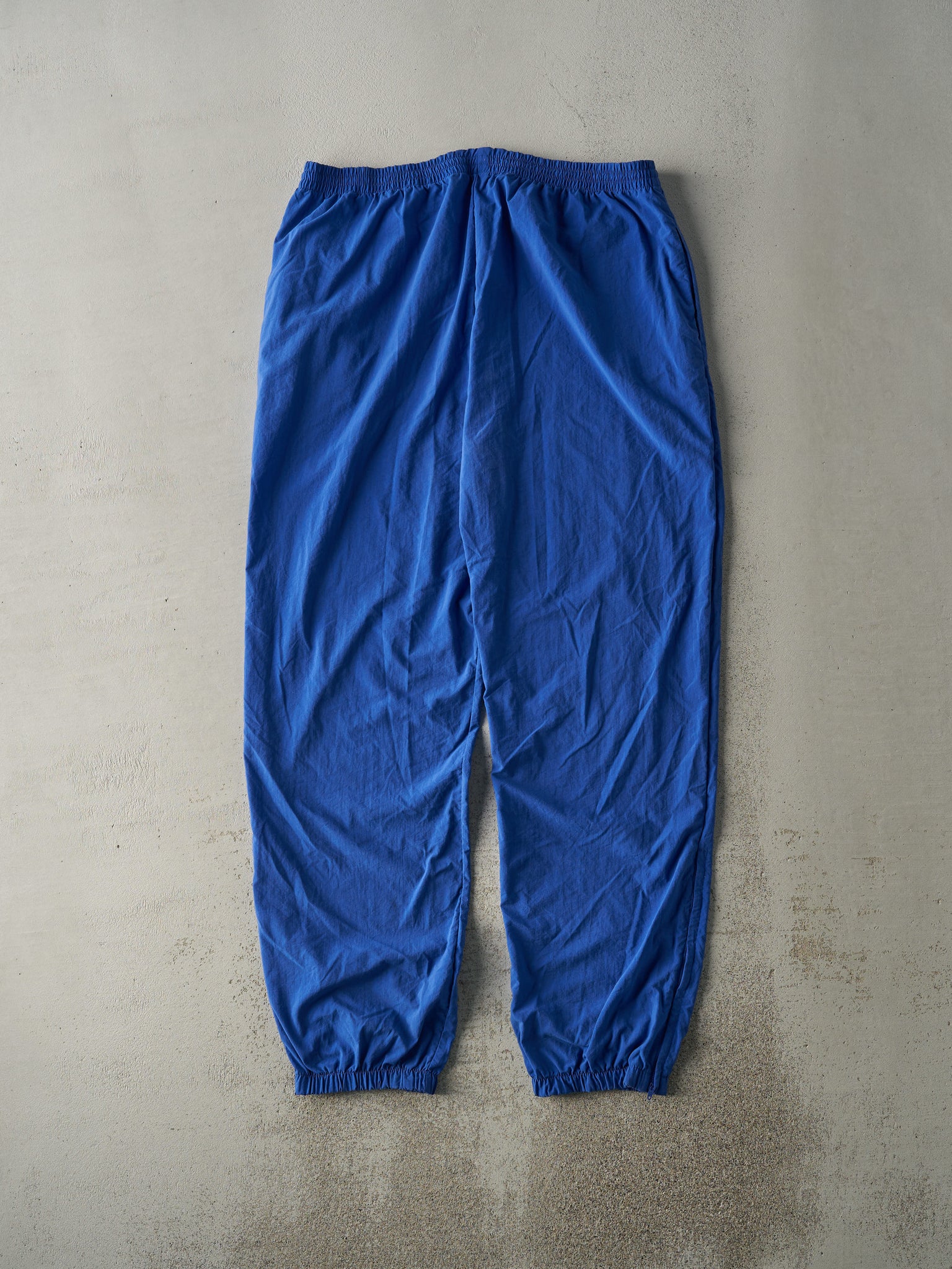 Vintage 90s Blue Champion Embroidered Logo Nylon Windbreaker Pants (36x32.5)