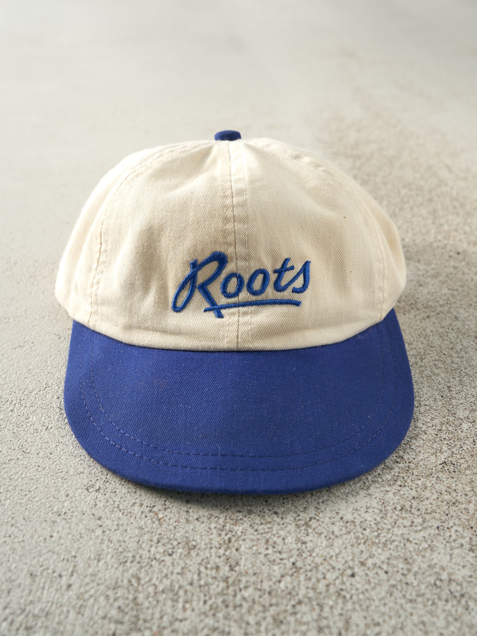 Vintage 90s Beige & Blue Embroidered Roots Leather Strap Back Hat