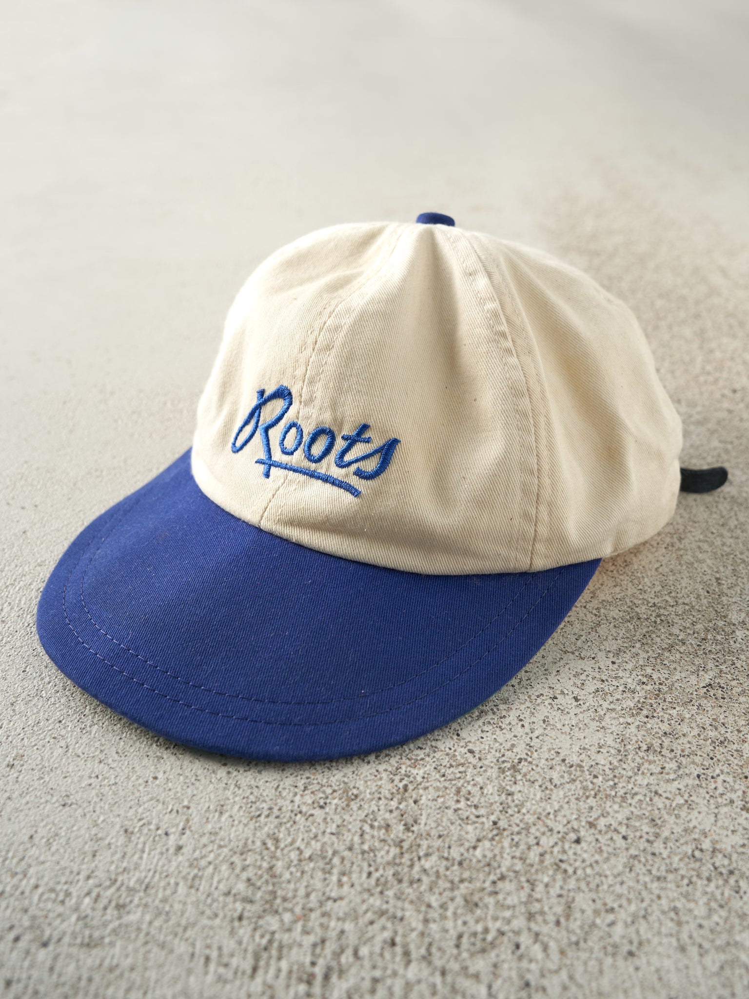 Vintage 90s Beige & Blue Embroidered Roots Leather Strap Back Hat