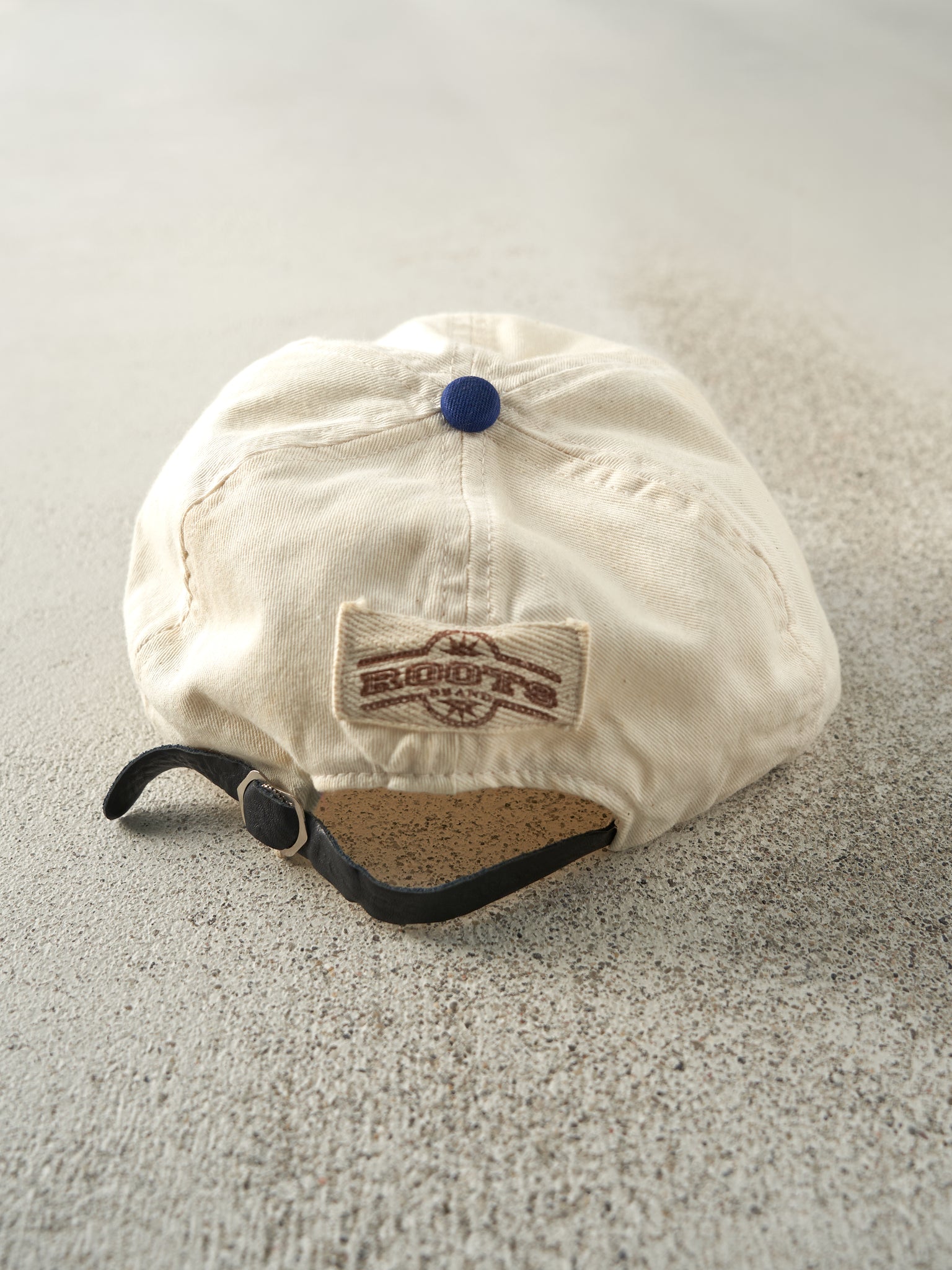 Vintage 90s Beige & Blue Embroidered Roots Leather Strap Back Hat