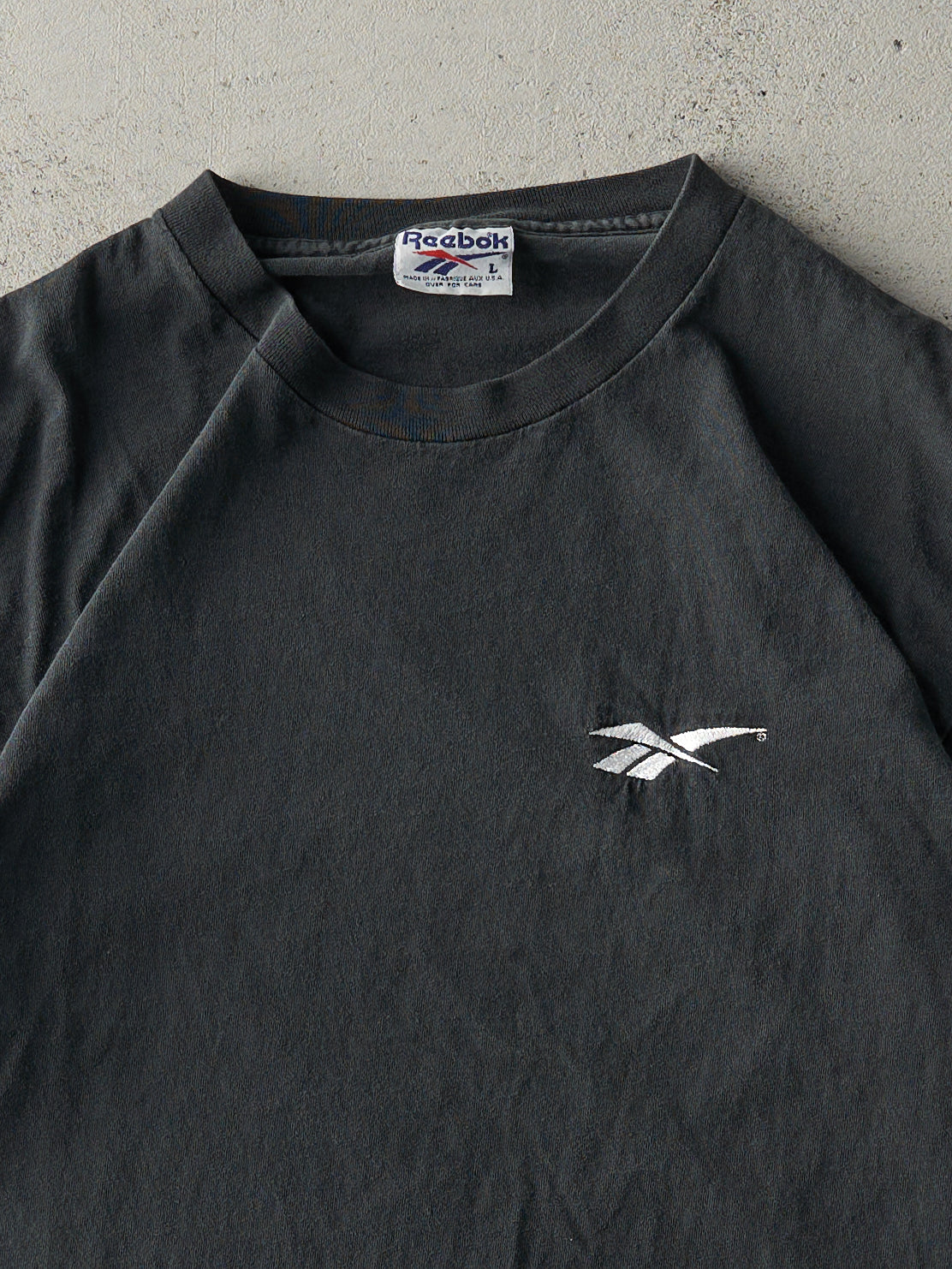 Vintage 90s Faded Black Embroidered Reebok Logo Tee (M/L)