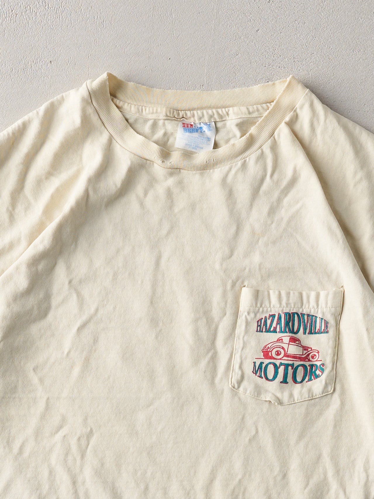 Vintage '93 Washed Yellow Hazardville Motors Single Stitch Tee (L)