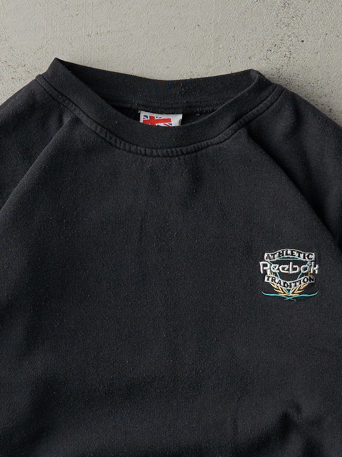 Vintage 80s Faded Black Embroidered Reebok Crewneck (M)