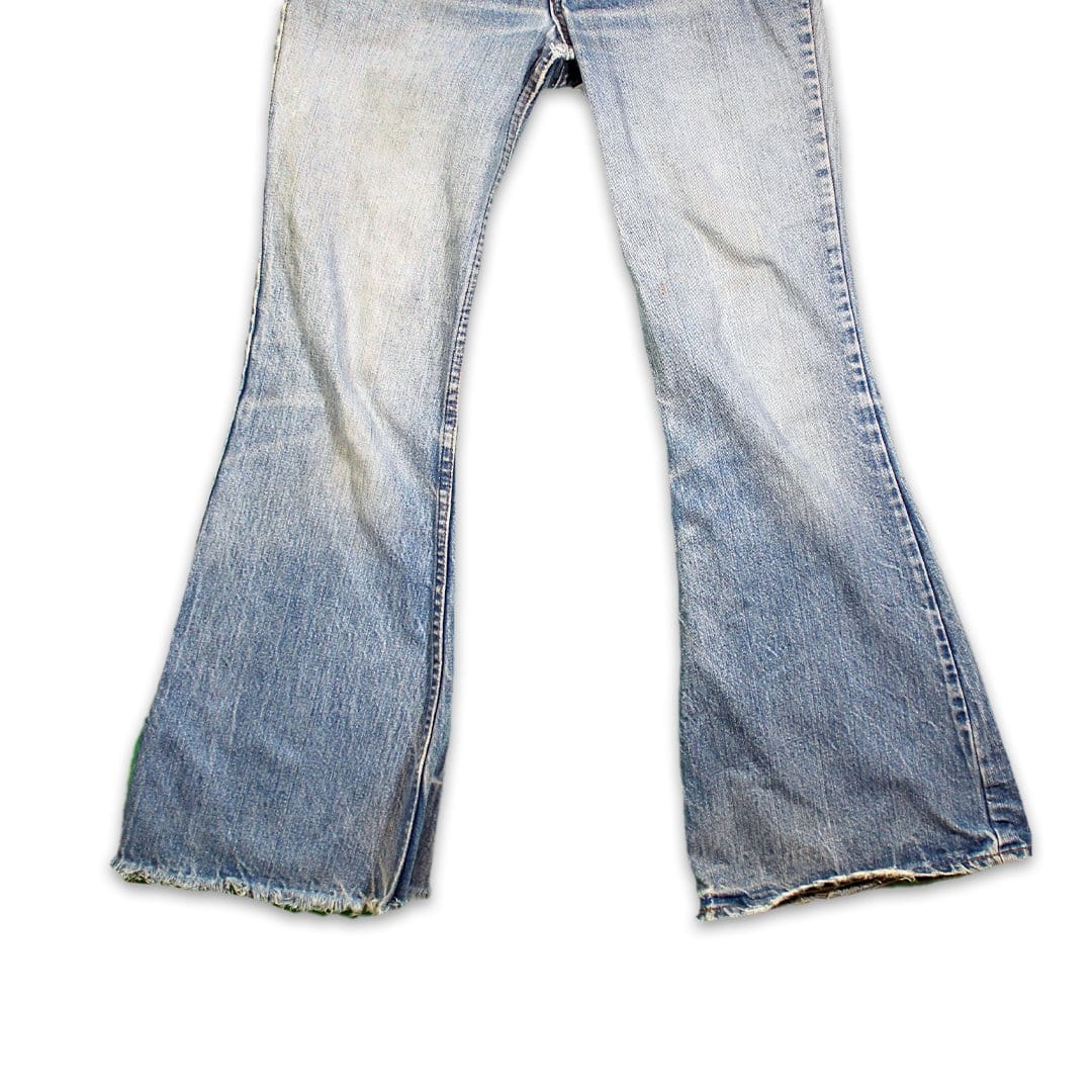 Vintage 80s High Waisted Distressed Levi Bellbottom Jeans | Rebalance Vintage.
