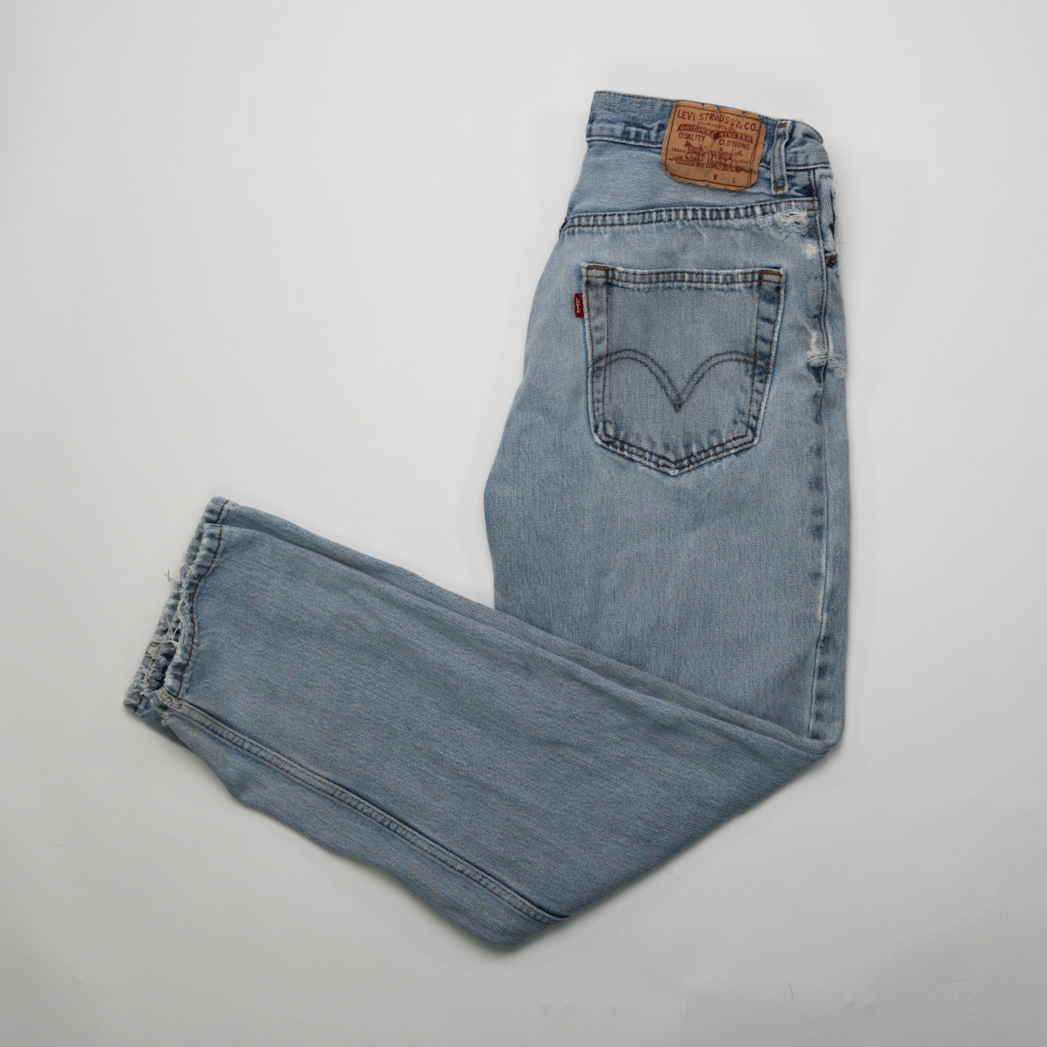 Vintage Light Washed Ripped Levi Jeans (32 x 31) | Rebalance Vintage.