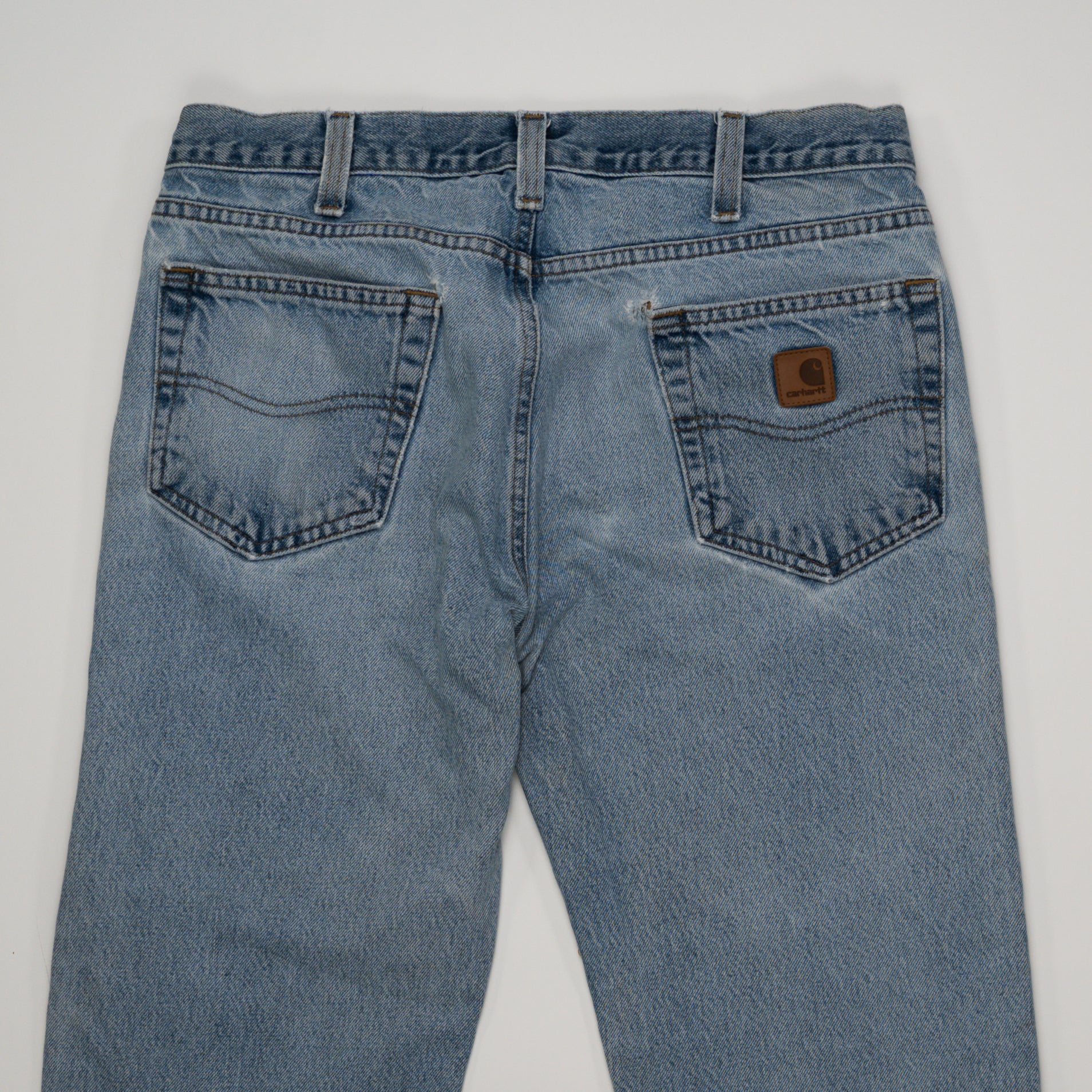 Vintage Carhartt Light Washed Ripped Jeans (34 x 30) | Rebalance Vintage.