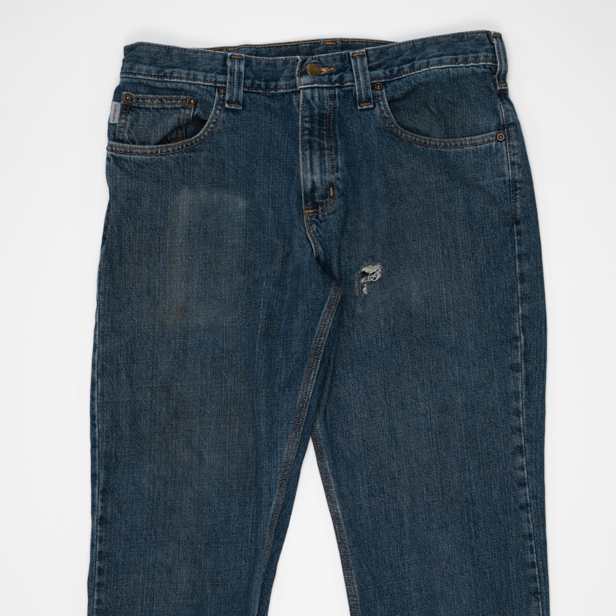 Vintage Dark Blue Carharrt Jeans w/ Rip (32) | Rebalance Vintage.