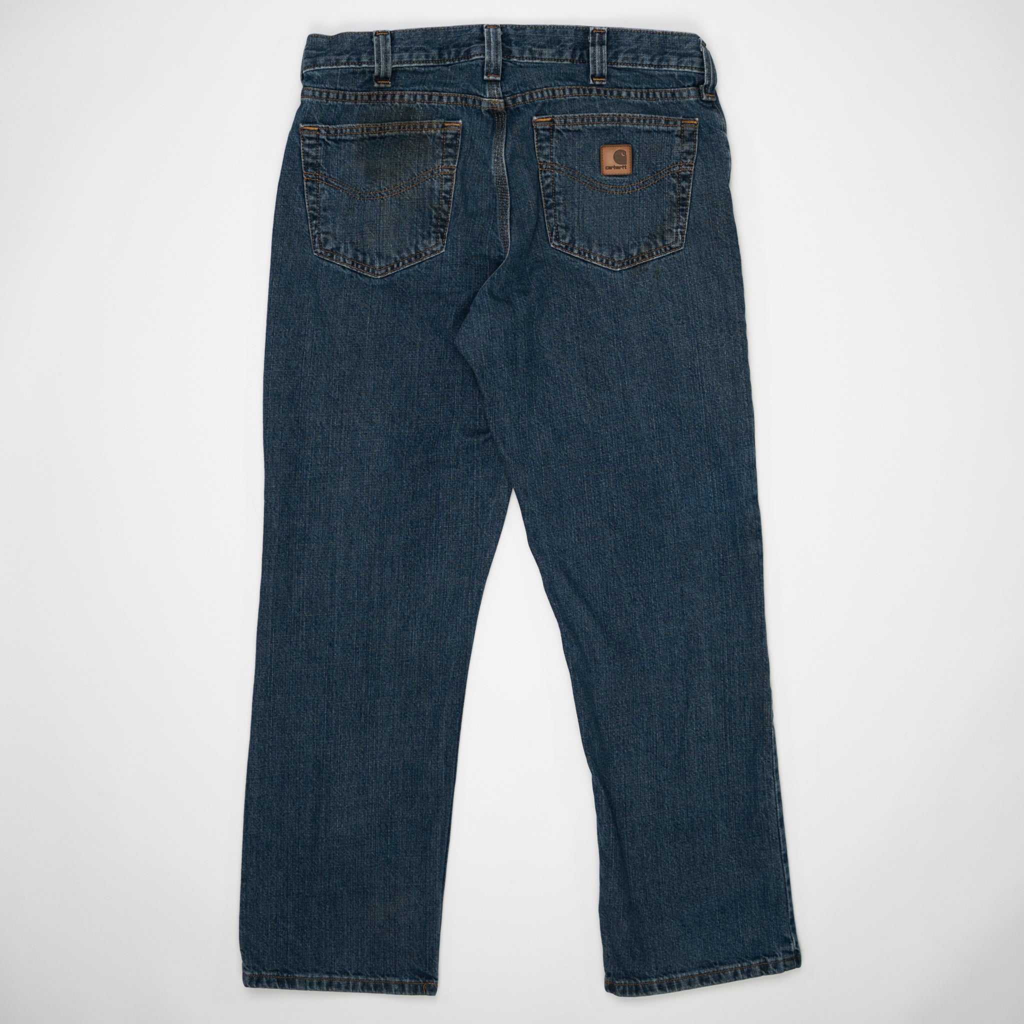 Vintage Dark Blue Carharrt Jeans w/ Rip (32) | Rebalance Vintage.