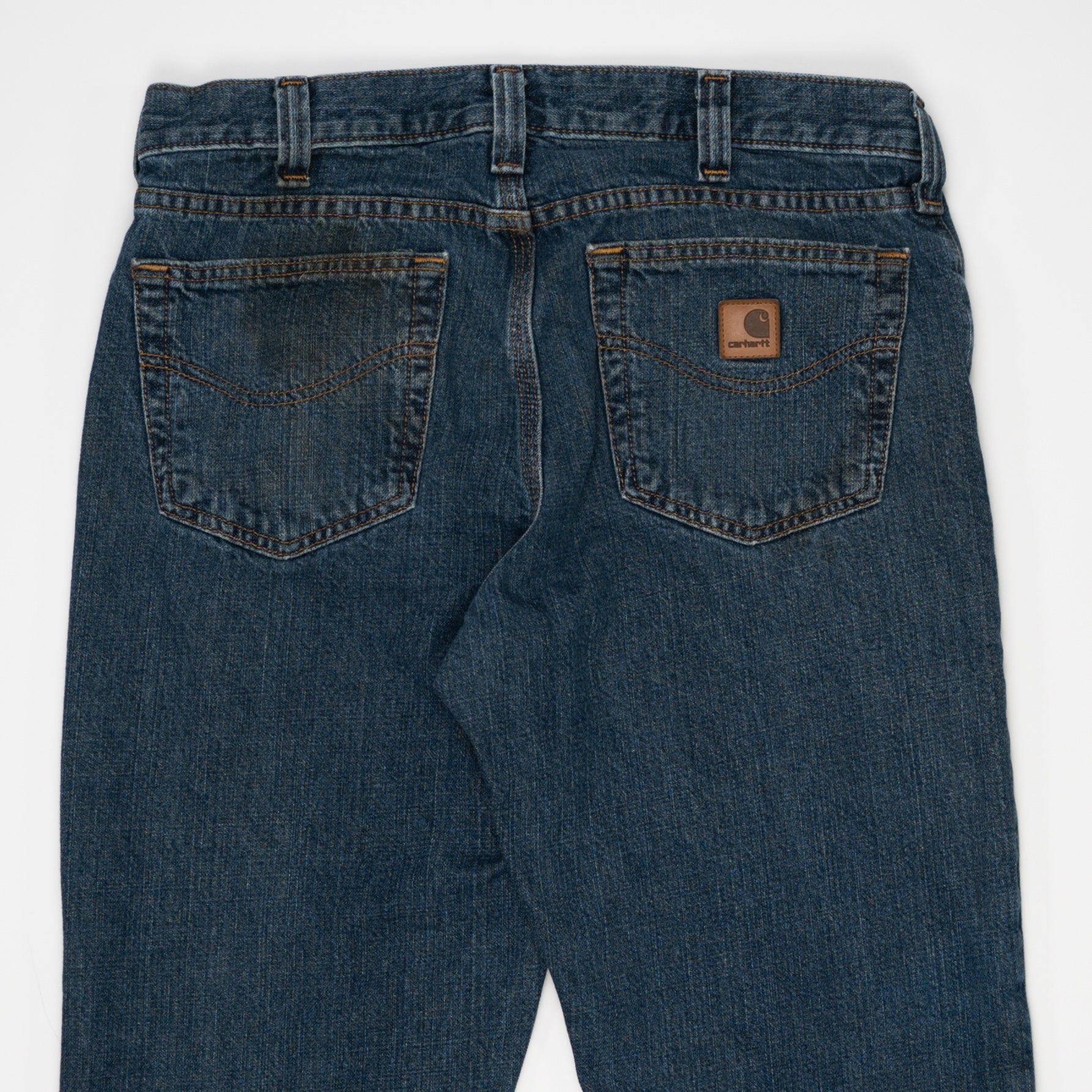 Vintage Dark Blue Carharrt Jeans w/ Rip (32) | Rebalance Vintage.
