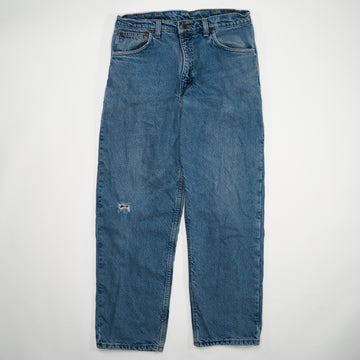 Vintage Blue Carhartt Jeans W/ Rip (34 x 30) | Rebalance Vintage.