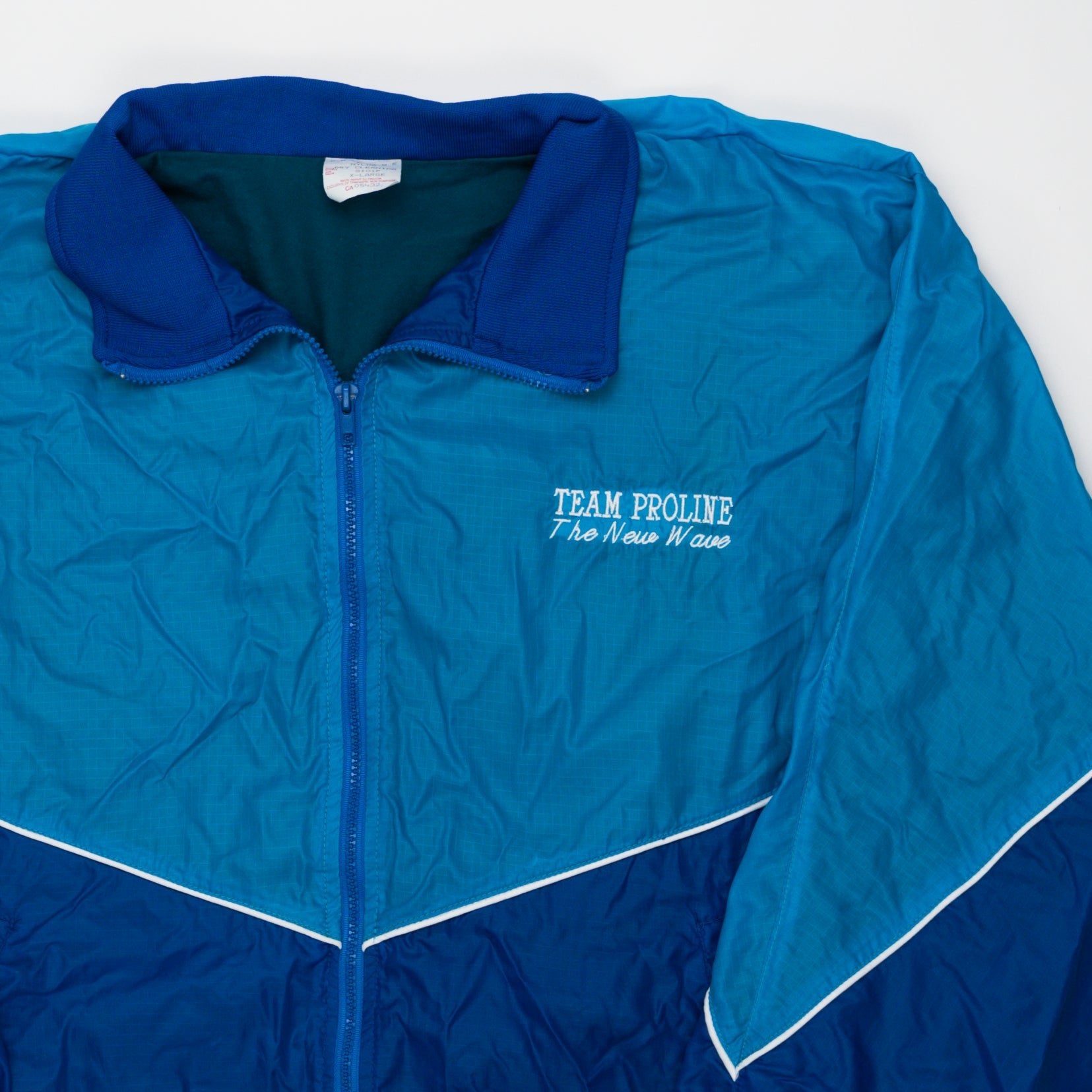 Vintage Blue Team Proline 'The New Wave' Jacket (XL) | Rebalance Vintage.