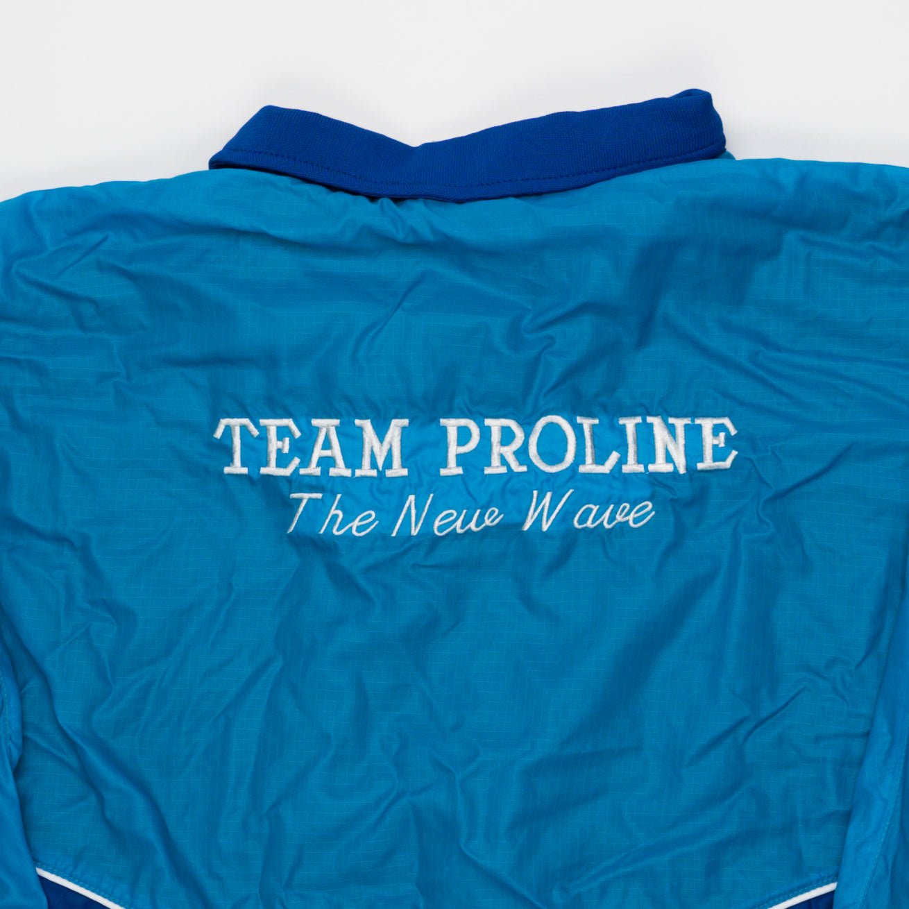 Vintage Blue Team Proline 'The New Wave' Jacket (XL) | Rebalance Vintage.