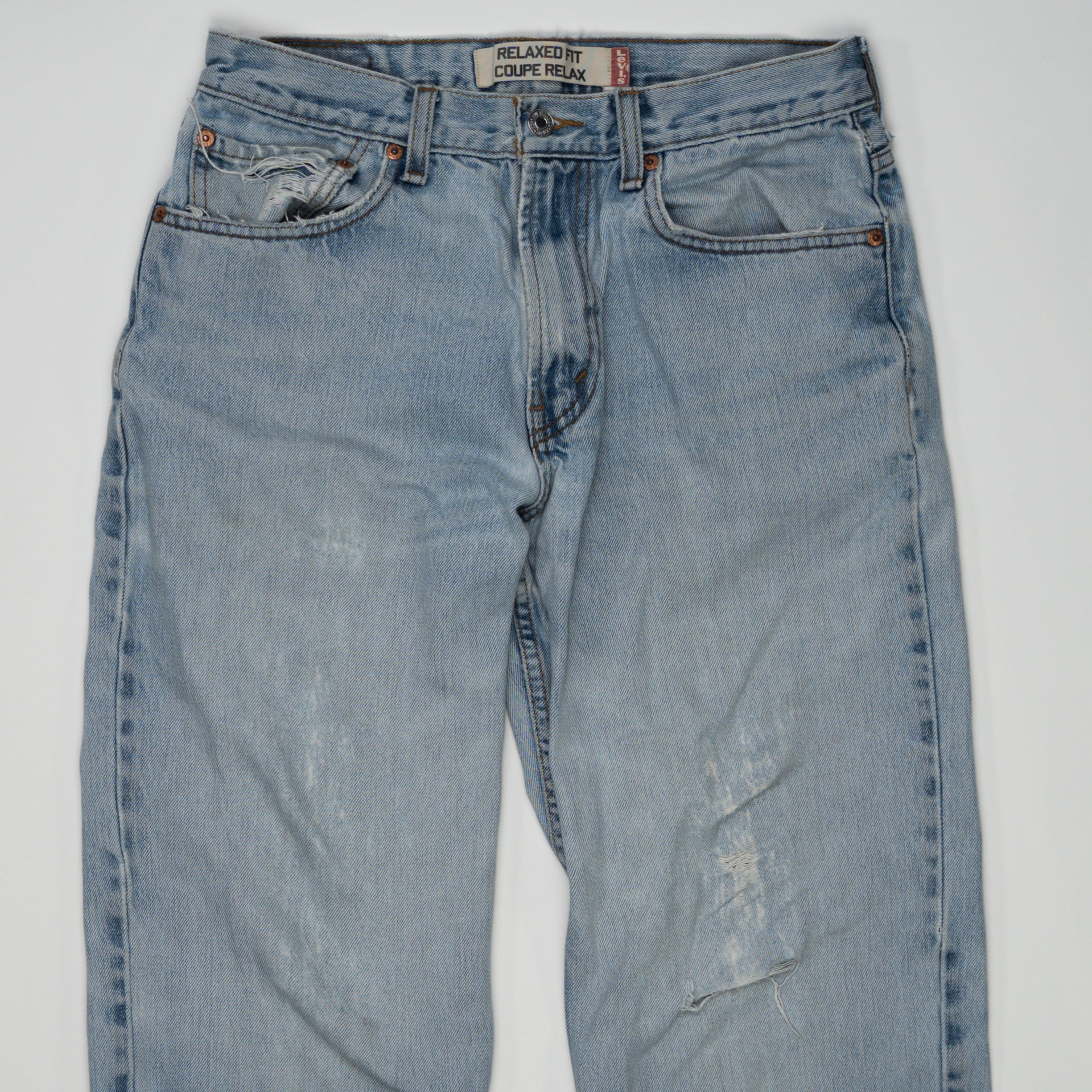 Vintage Light washed Ripped Levi Jeans (32 x 34) | Rebalance Vintage.