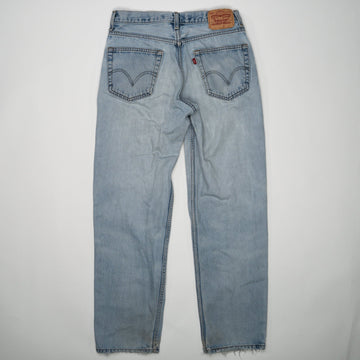 Vintage Light washed Ripped Levi Jeans (32 x 34) | Rebalance Vintage.