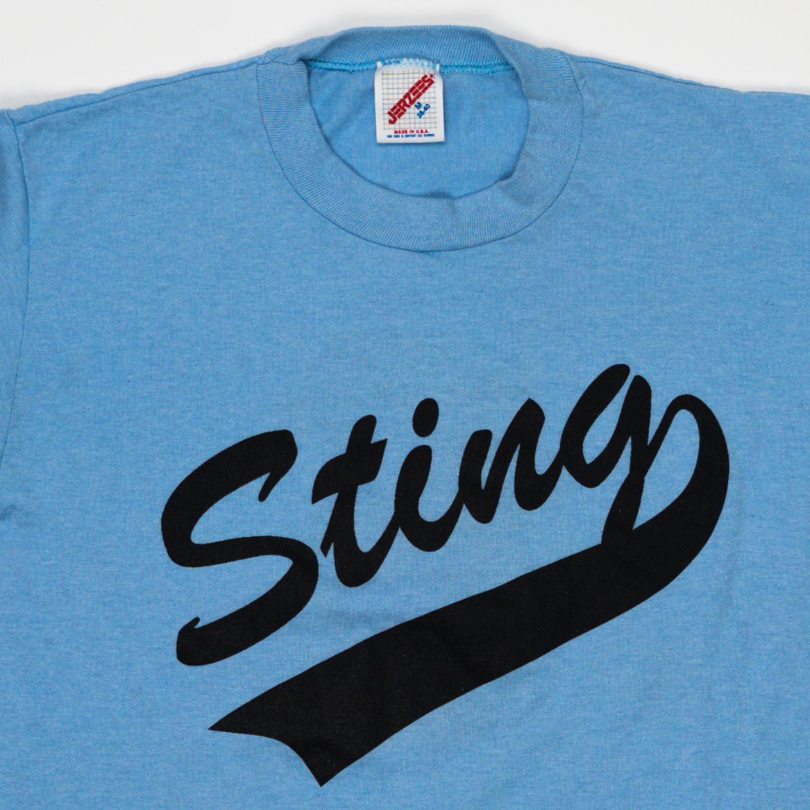 Vintage 80s Baby Blue Sting Tee (S) | Rebalance Vintage.