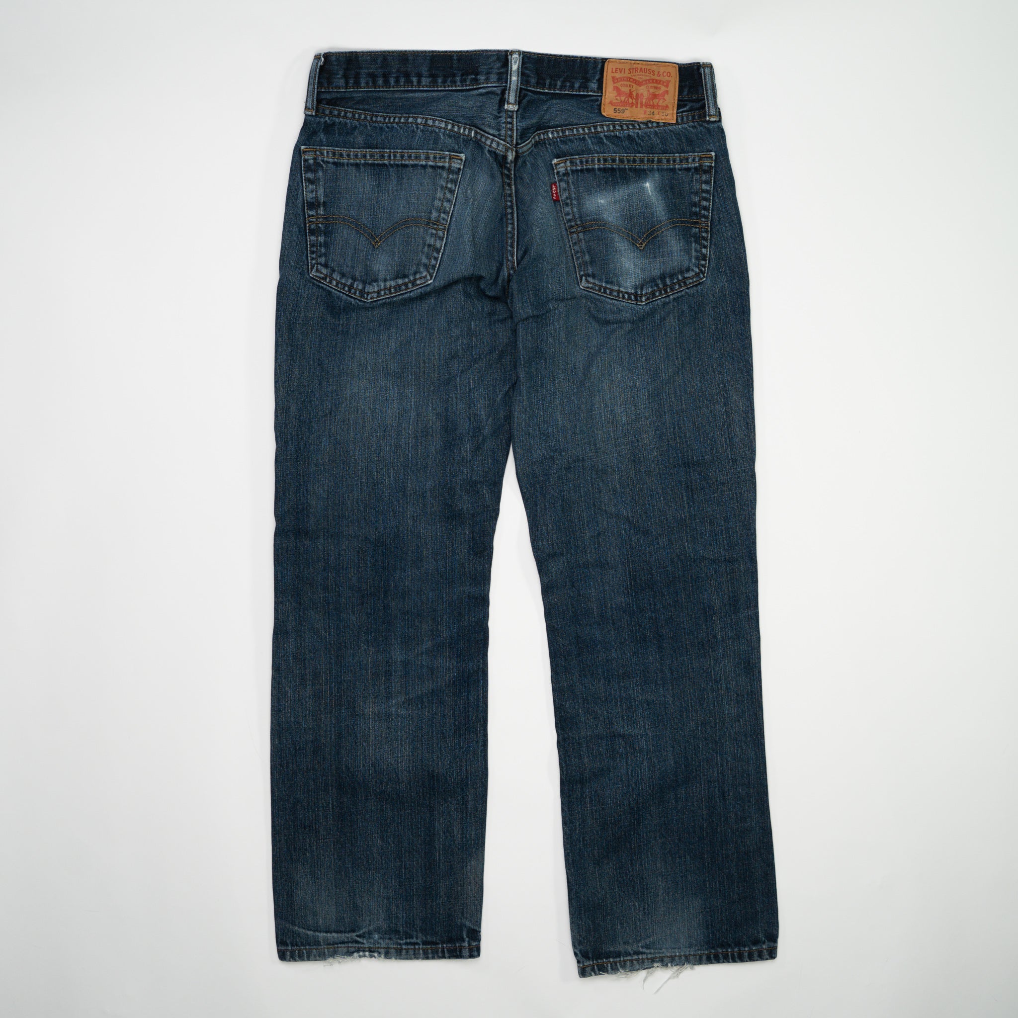 Vintage Dark Blue Levi 559 Jeans w/ Rips (34 x 30) | Rebalance Vintage.