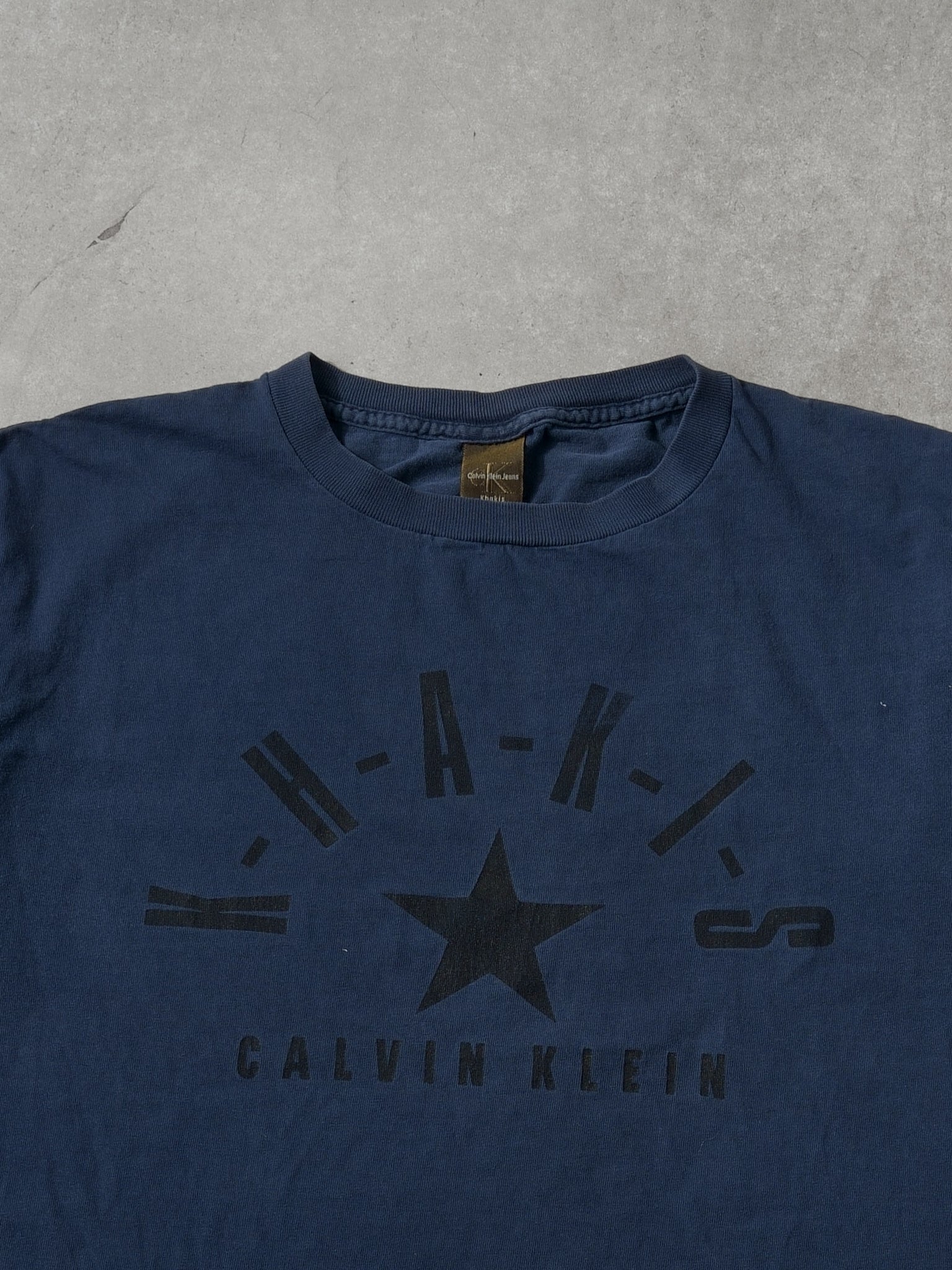 Vintage 90s Navy Blue Calvin Klein Khakis Jeans Graphic Tee (M)