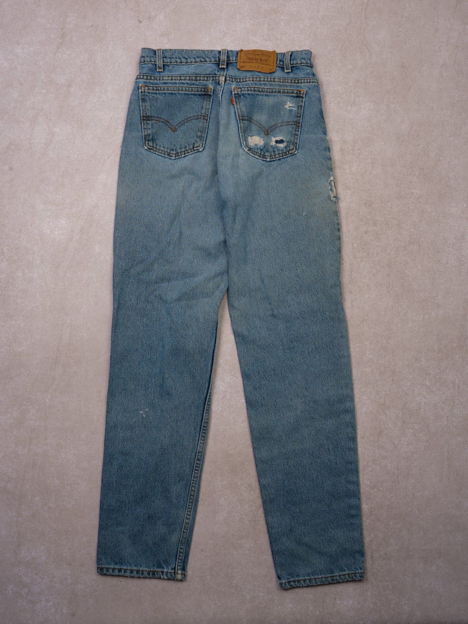 Vintage 90s Light Distressed Wash Levi's 550 Relax Fit Tappered Leg Denim Jean (28x32)