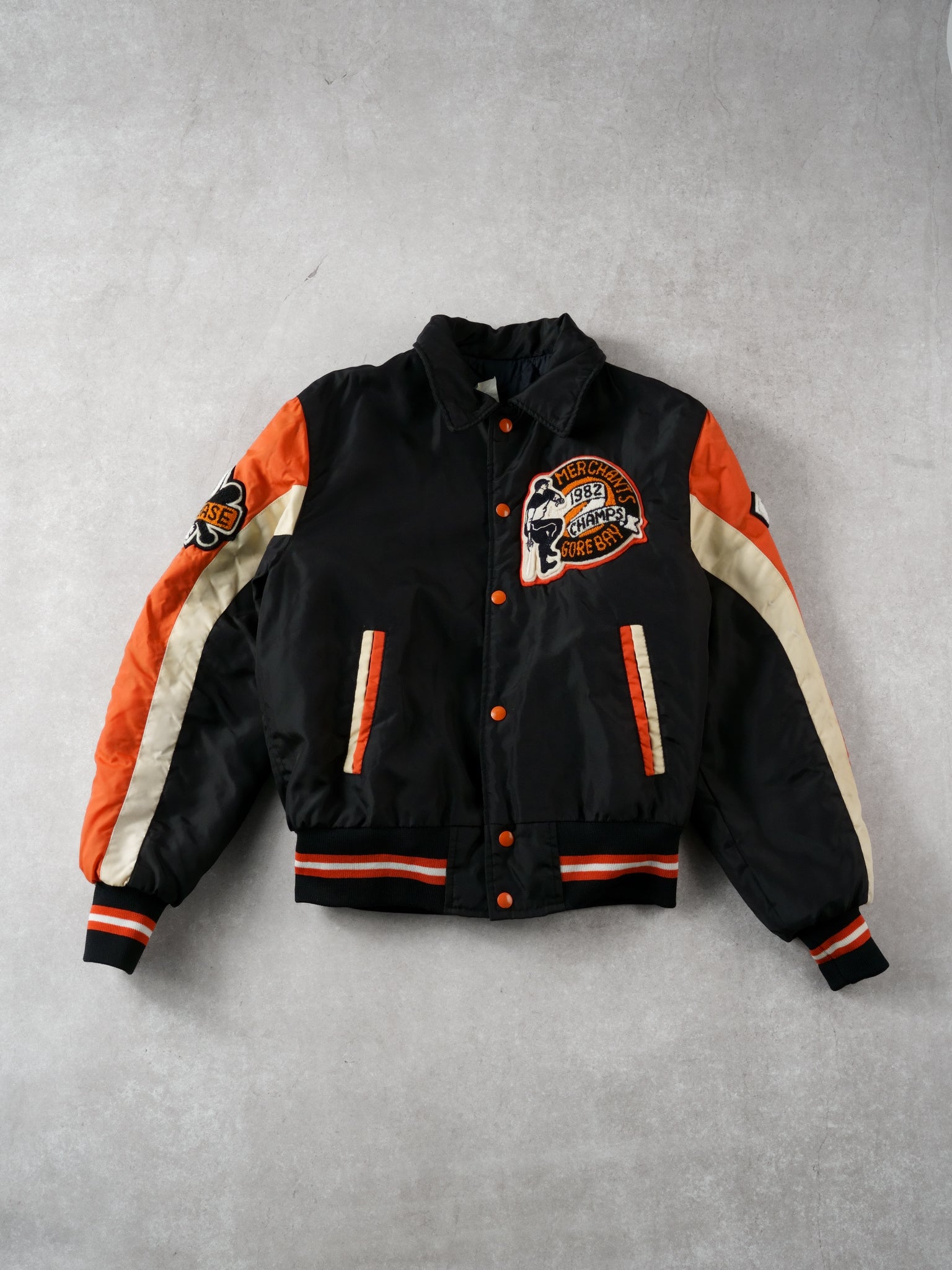 Vintage 82' Black and Orange Merchants Gorebays Champs Baseball Bomber (S/M)