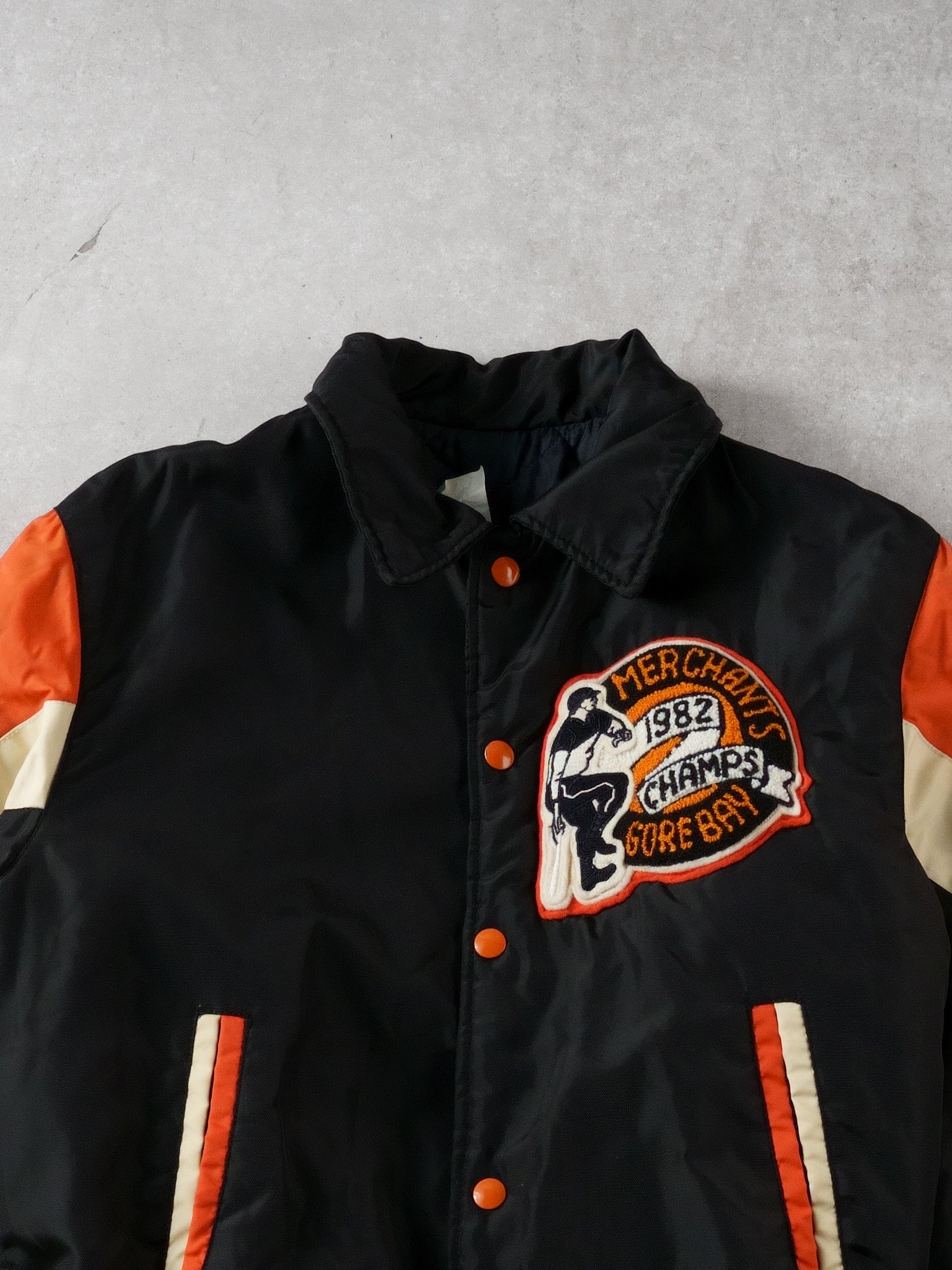 Vintage 82' Black and Orange Merchants Gorebays Champs Baseball Bomber (S/M)