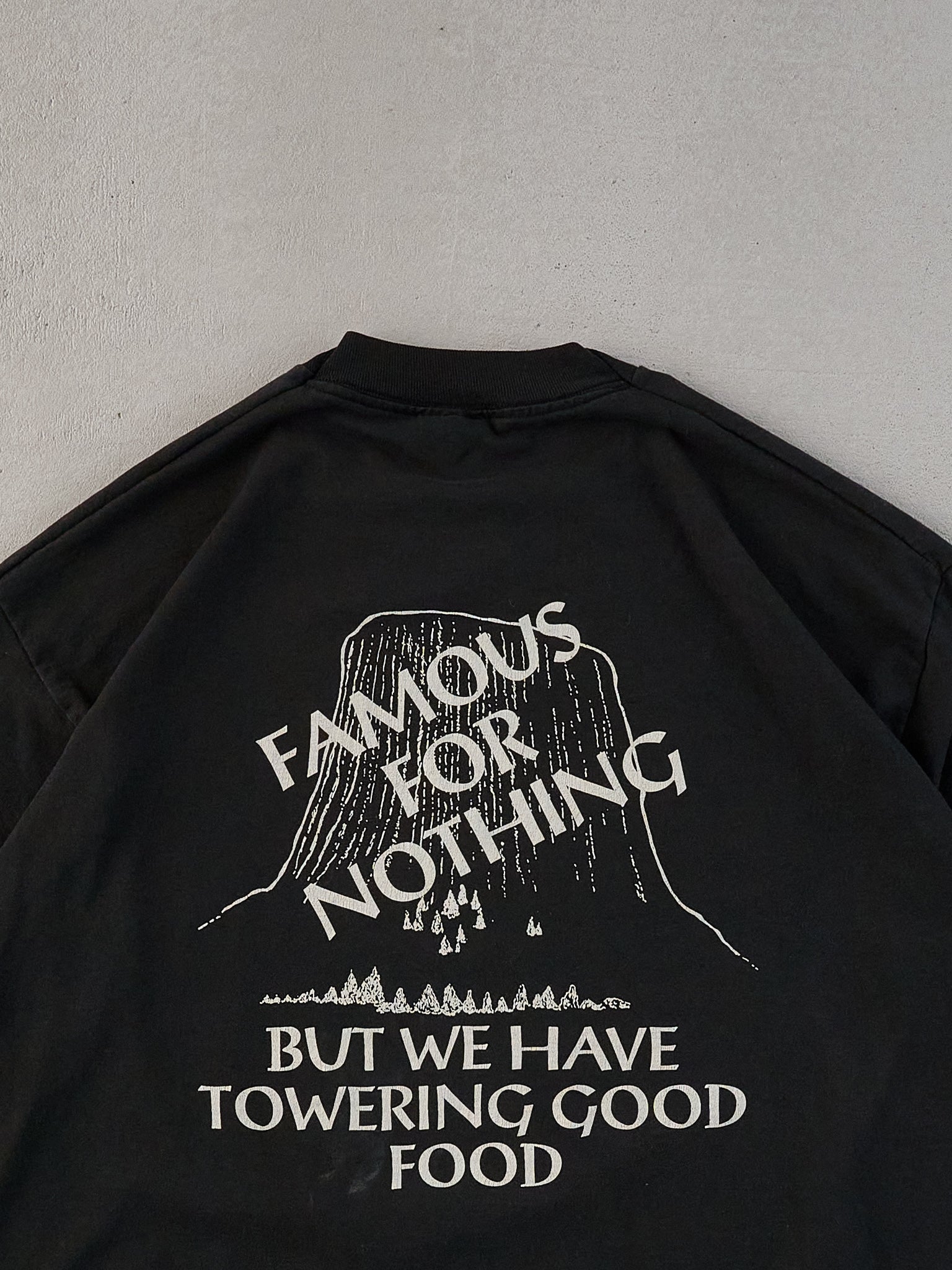 Vintage 90s Black Single Stitched "Famous For Nothing But We Have Towering Good Food" Tee (M/L)