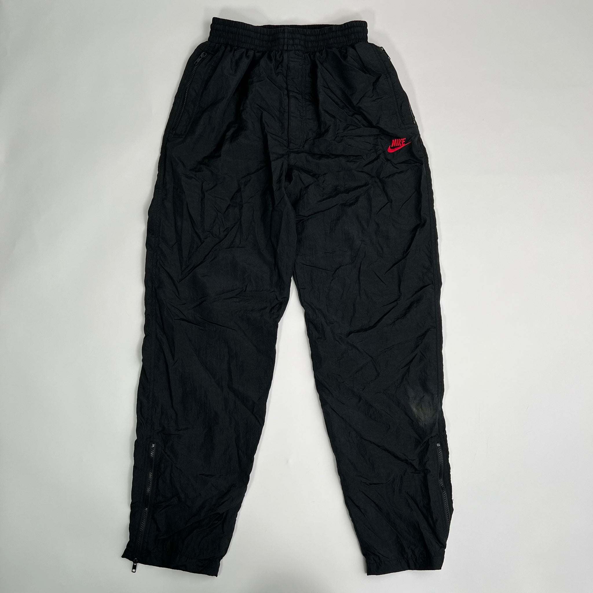 Vintage Black + Red Nike Windbreaker Pants (L) | Rebalance Vintage.